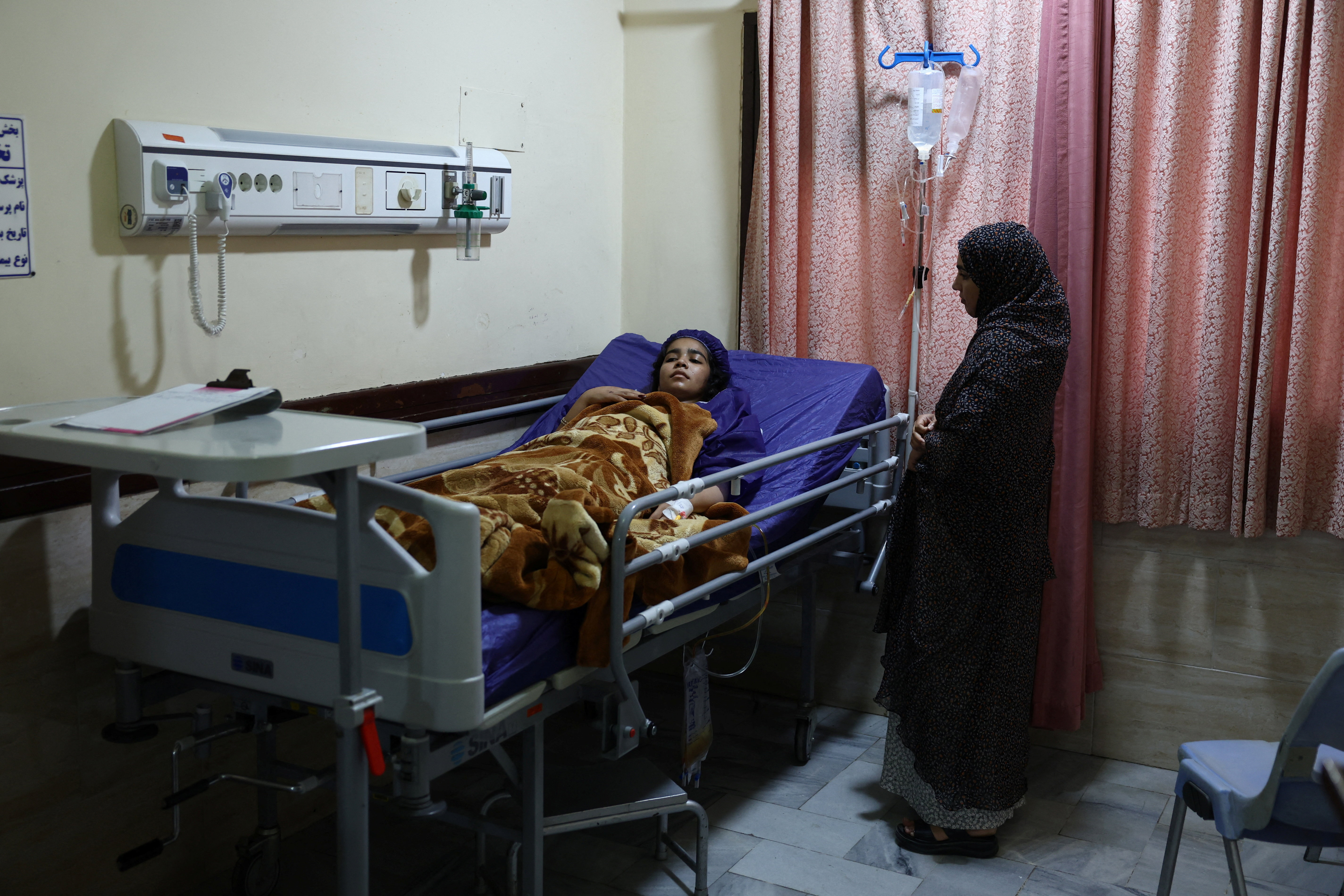 An injured person in a hospital following a US attack on a telecommunications tower in Kuhestak, in Minab, Iran, September 4, 2026. [Majid Asgaripour/WANA via Reuters]
