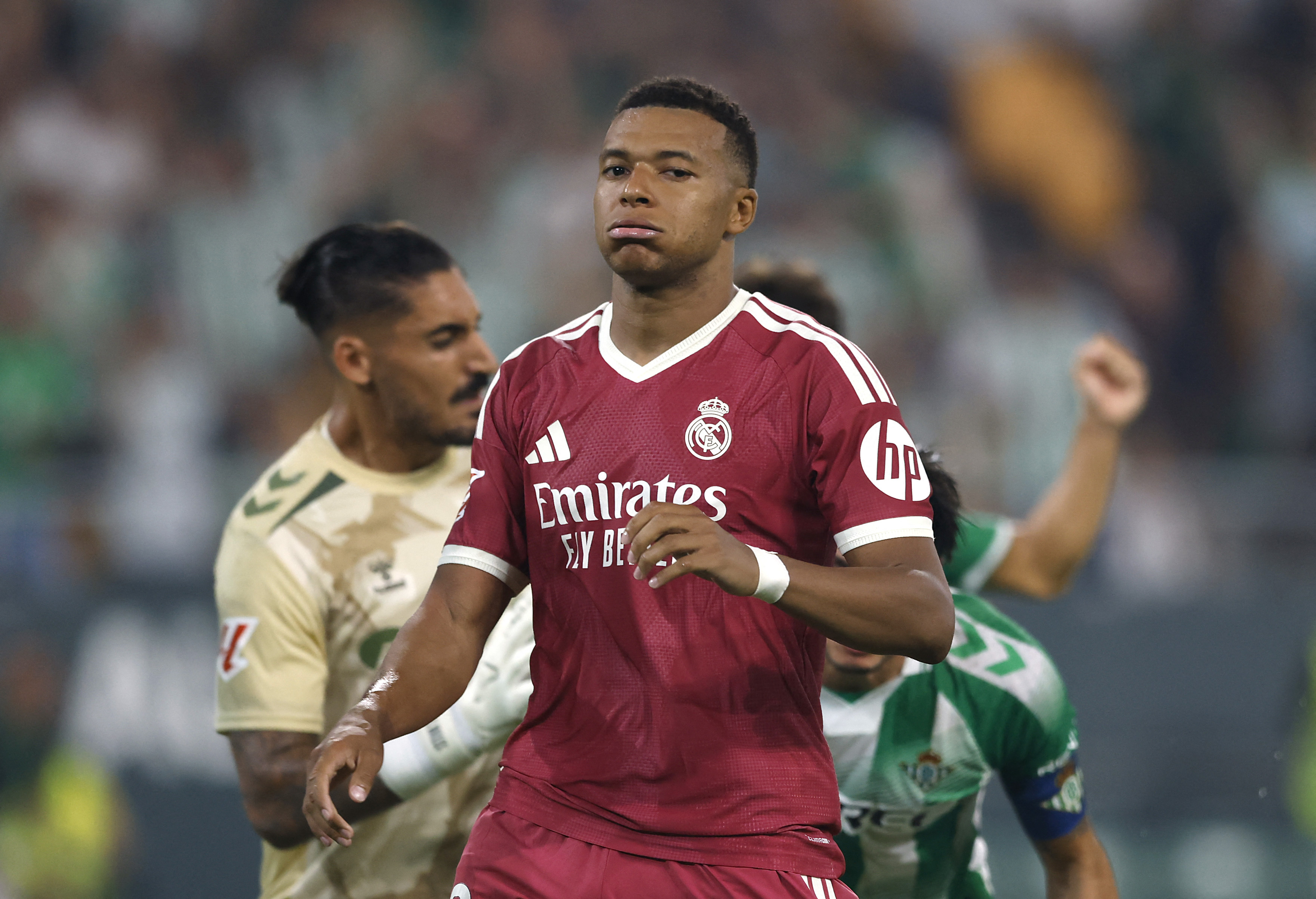 Real Madrid's Kylian Mbappe looks dejected after his penalty is saved by Real Betis' Alvaro Valles