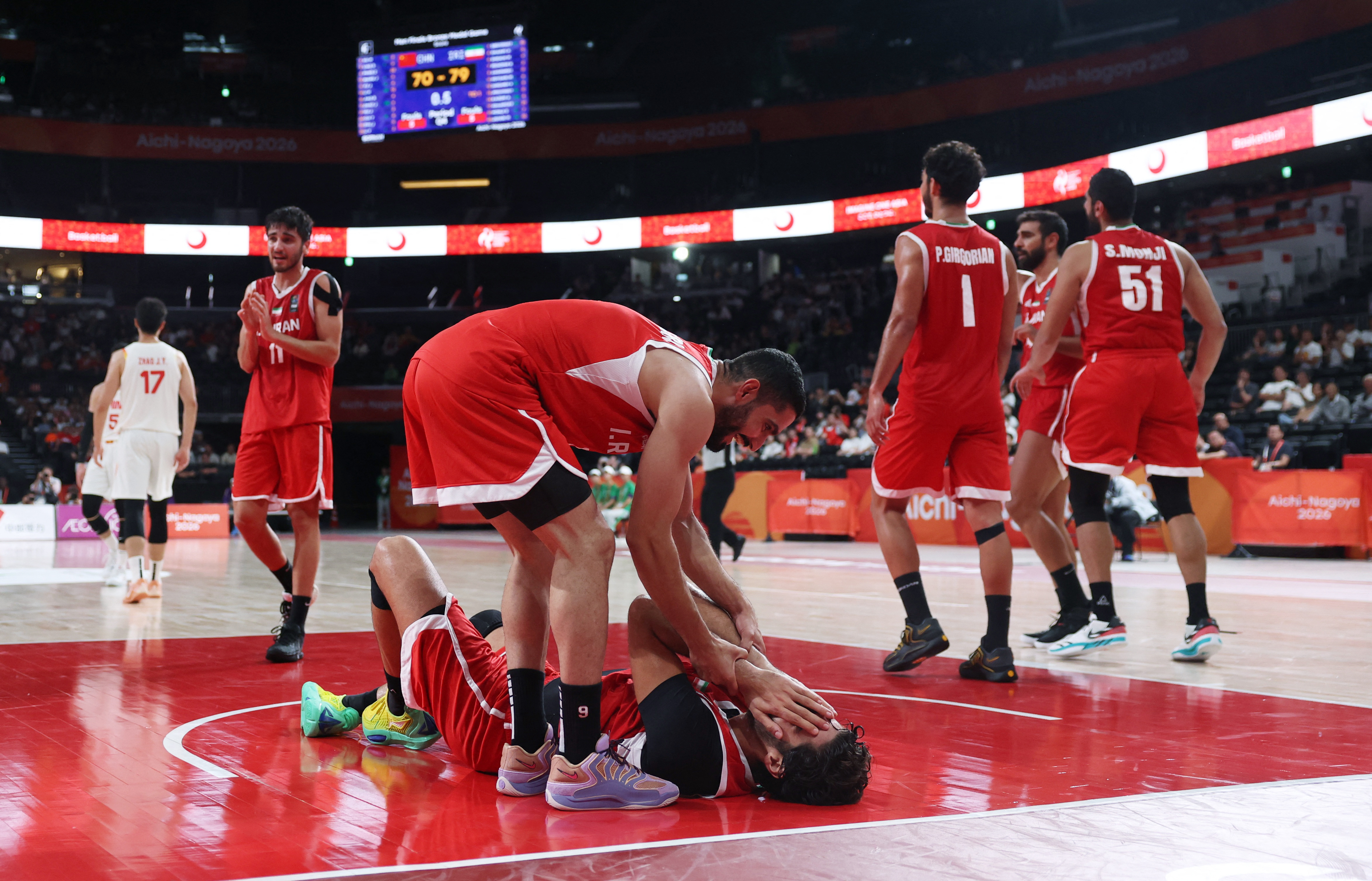 Asian Games - Aichi-Nagoya 2026 - Basketball - Men's - Bronze Medal Match - China v Iran - Aichi International Arena, Nagoya, Japan - September 20, 2026 Iran's Matin Aghajanpour and Iran's Mahdi Jafari celebrate winning bronze in the Men's Basketball REUTERS/Edgar Su