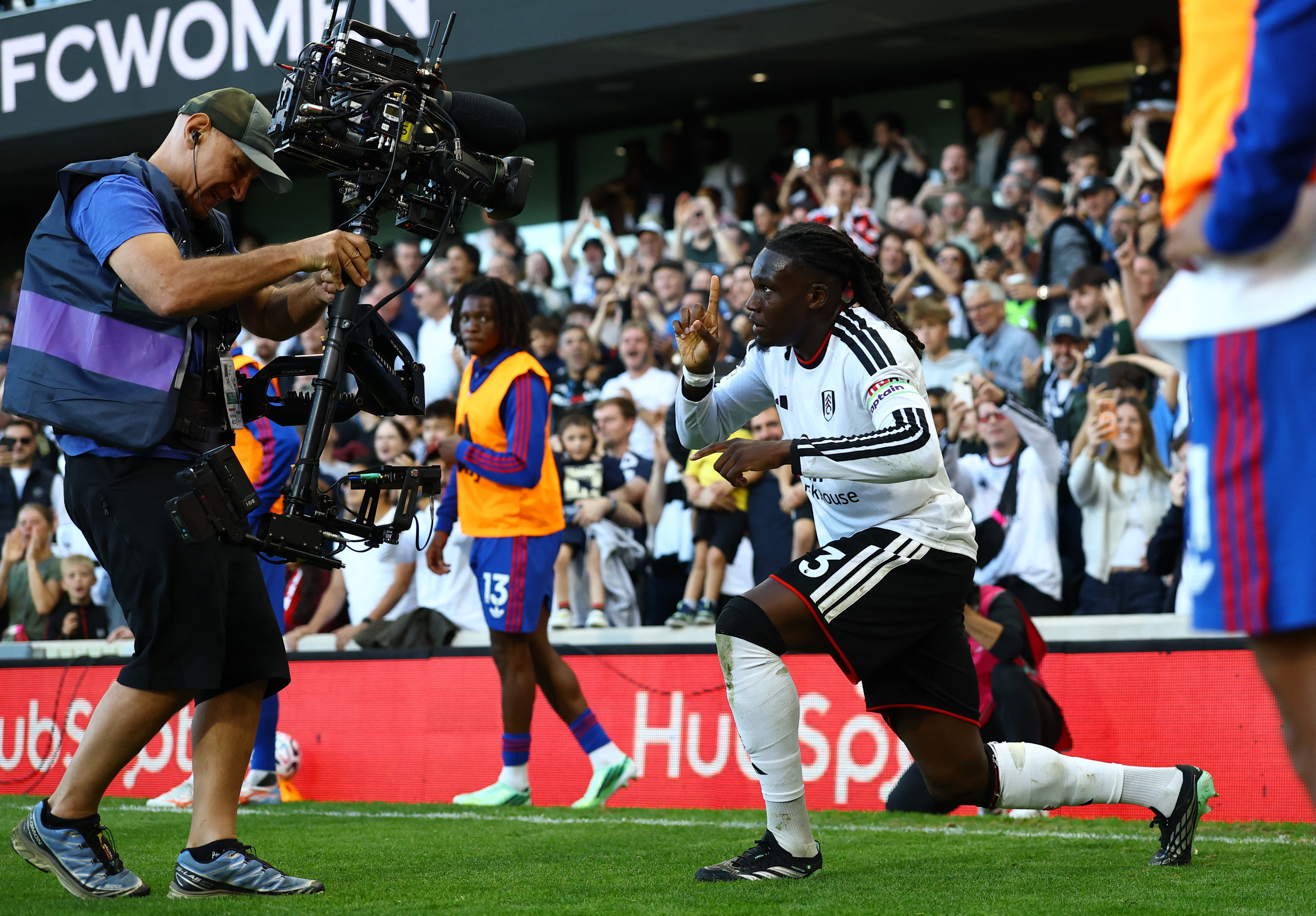 Fulham's Calvin Bassey celebrates their first goal, an own goal scored by Manchester United's Lisandro Martinez