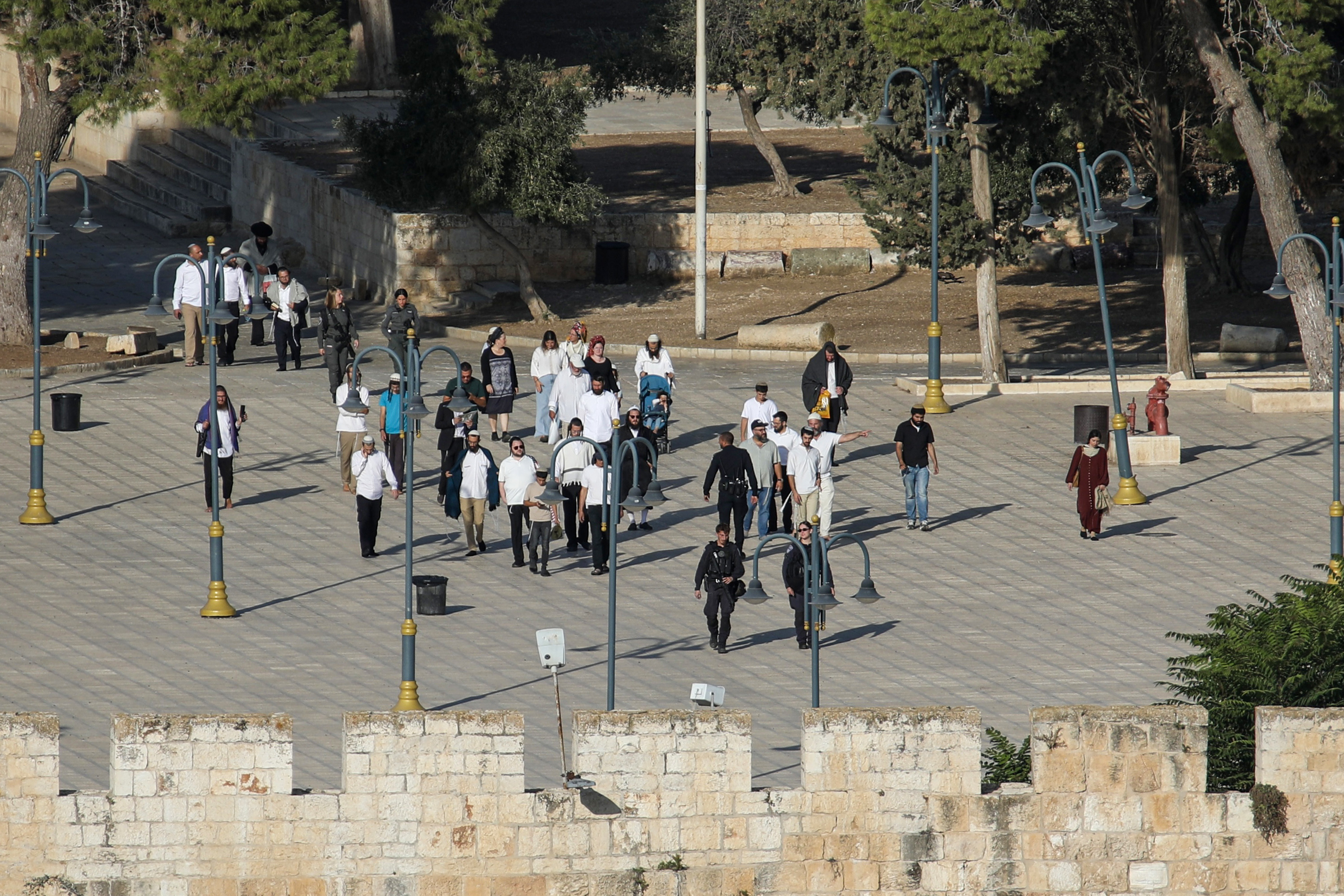 Israelis enter the Al-Aqsa Mosque compound under the protection of Israeli police on the third day of the Jewish holiday of Sukkot