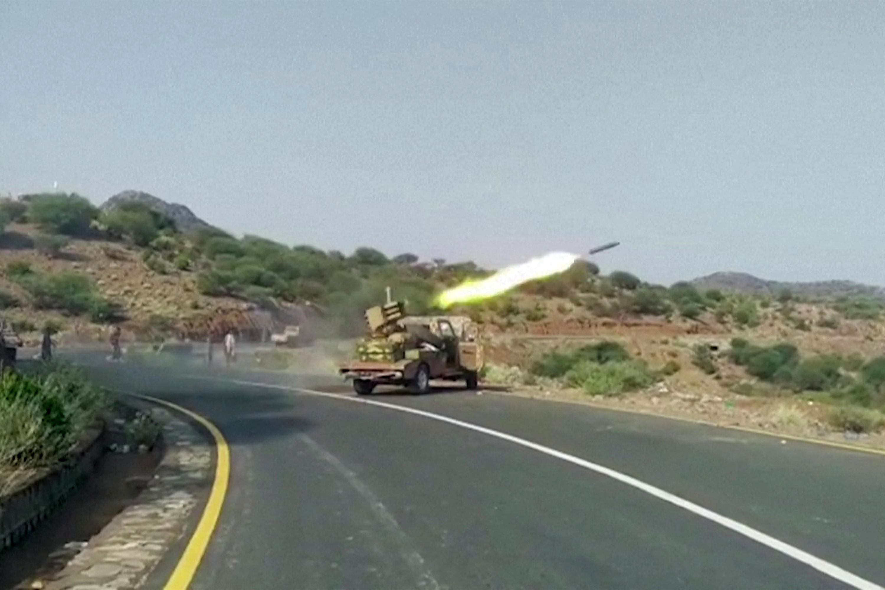 A rocket is fired at Houthi fighters on the Kadha front, west of the city of Taiz, in Yemen [National Resistance Forces via AFP]