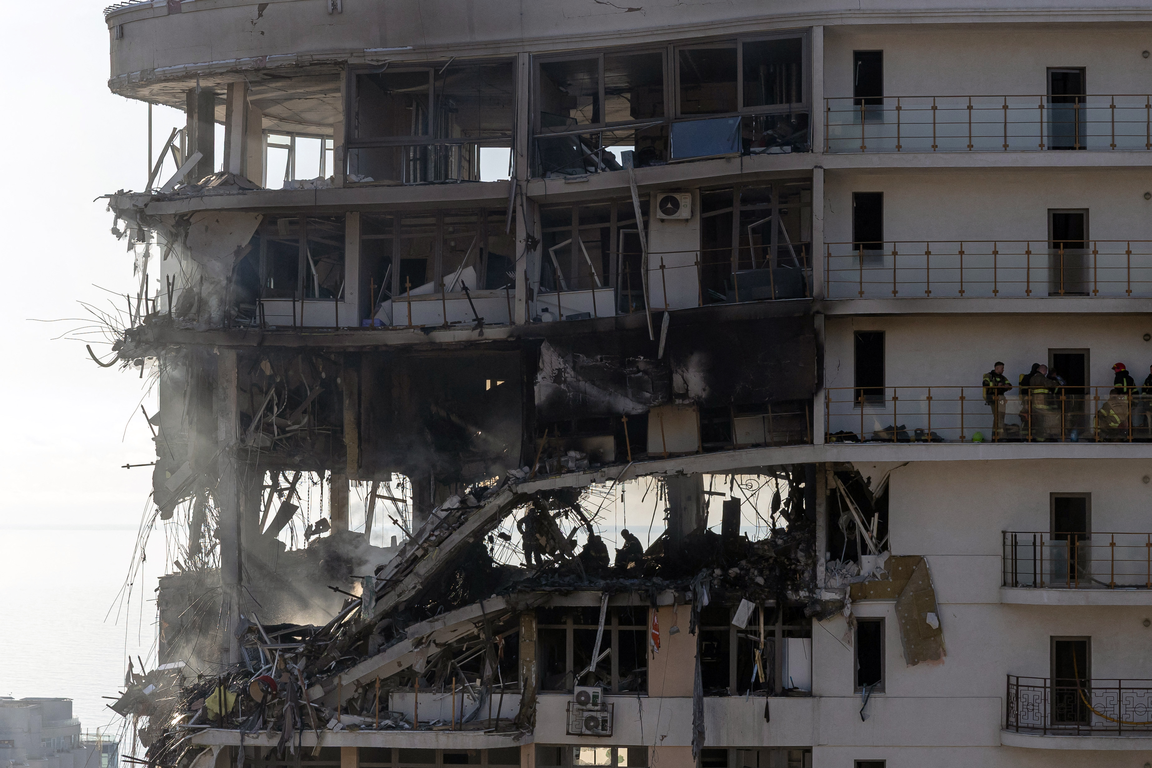 Rescuers work in a multistorey residential building.