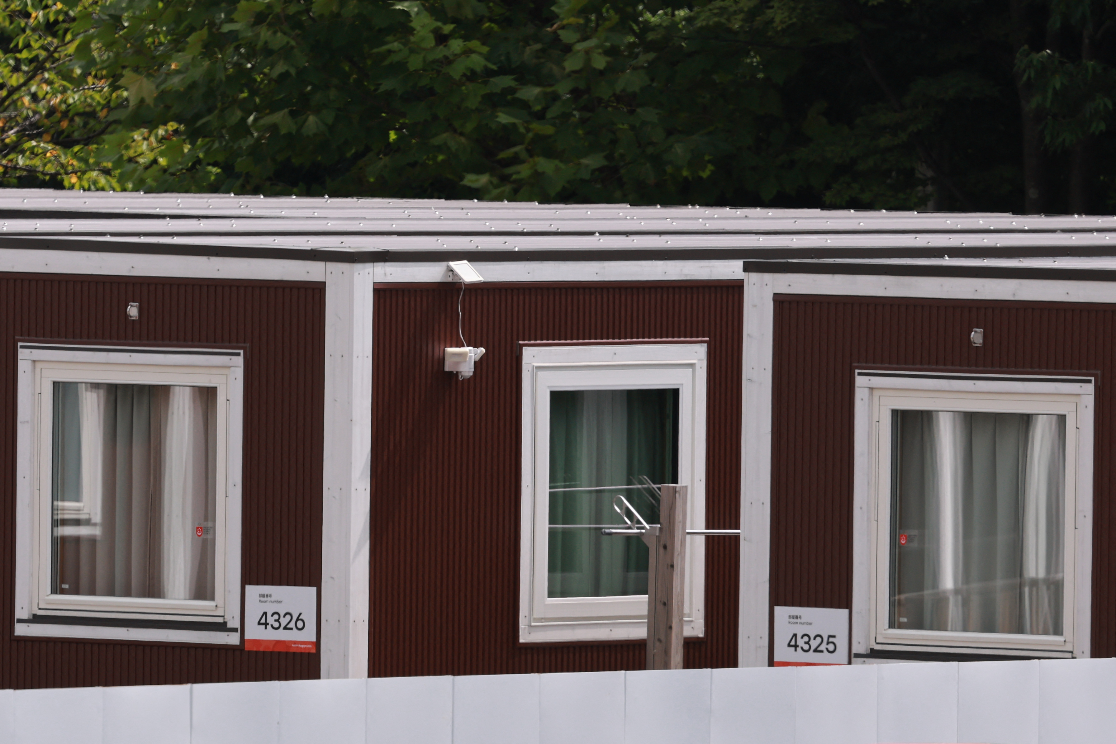 Temporary wooden container huts being used to house athletes for the 2026 Asian Games are seen at the Garden Pier in Nagoya on September 17, 2026. (Photo by DAVID GRAY / AFP)