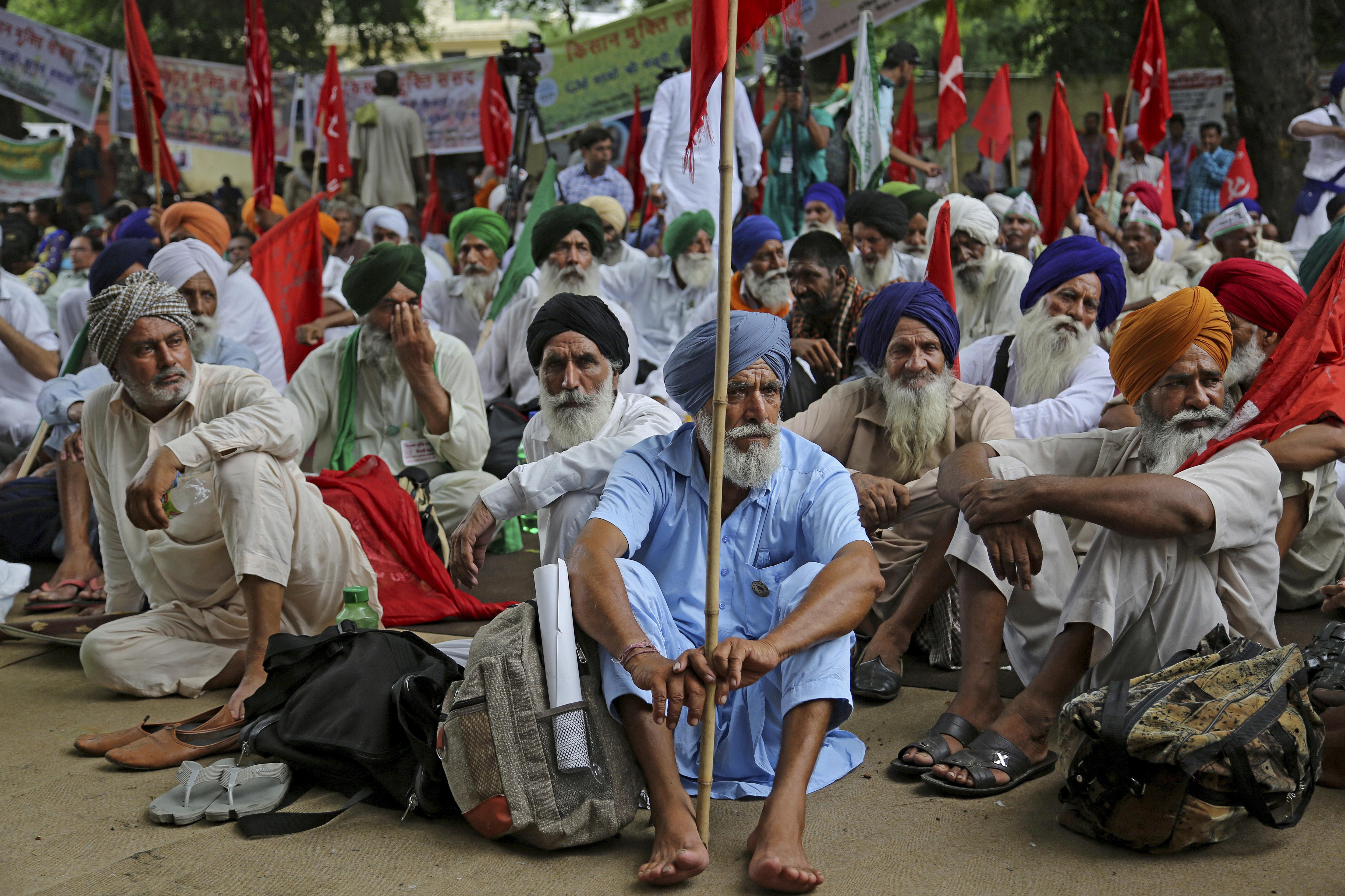 Indian farmers listen to a speaker during a protest against Indian Prime Minister Narendra Modi and his government in New Delhi, India, Wednesday, July 19, 2017. Farmers are demanding better prices for their produce and relief from debts. (AP Photo/Altaf Qadri)