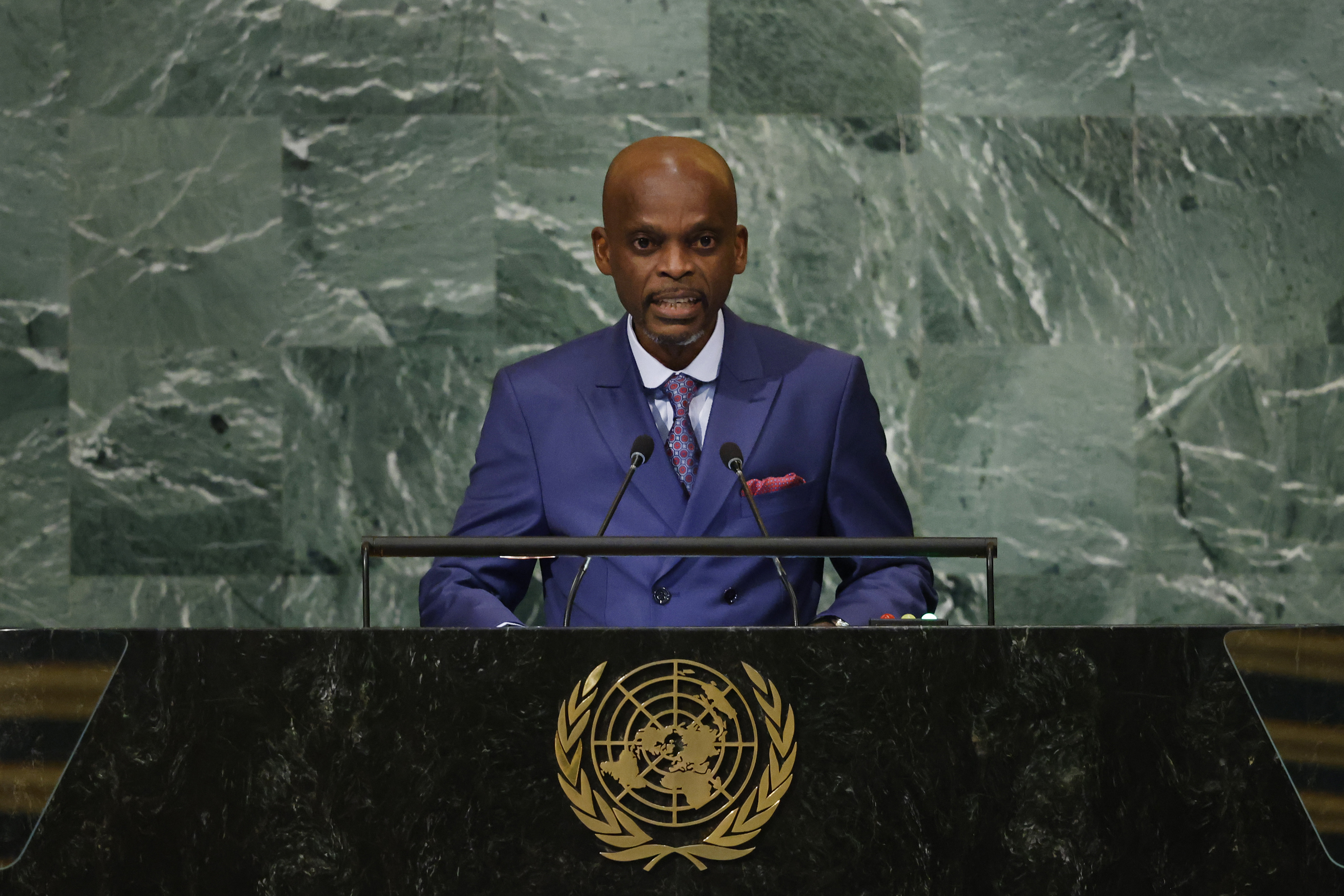Foreign Minister of Togo Robert Dussey speaks at a lectern.
