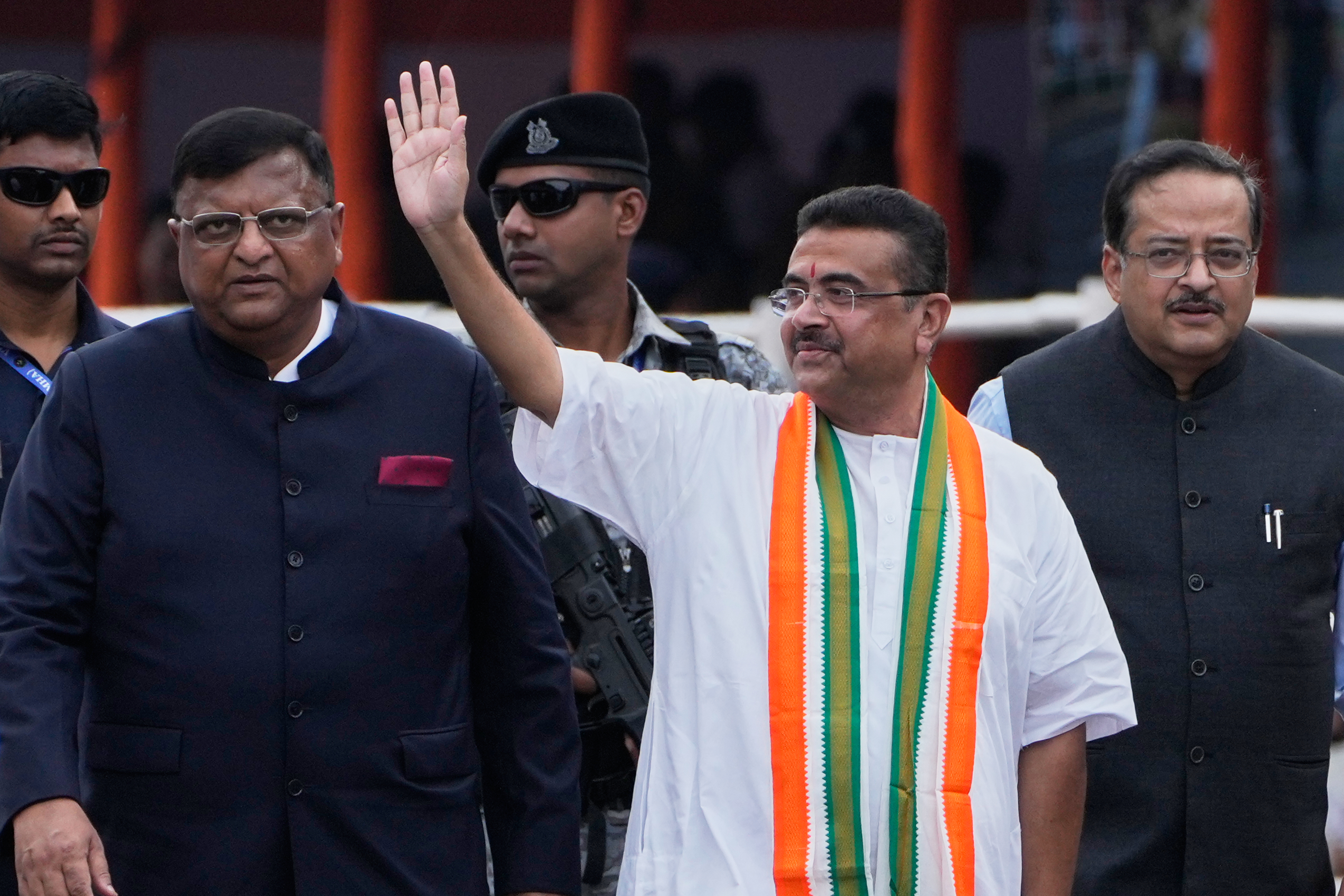 West Bengal state Chief Minister Suvendu Adhikari, center, greets the crowd as he arrives to join the Independence Day celebrations, in Kolkata, India, Saturday, Aug. 15, 2026. (AP Photo/Bikas Das)