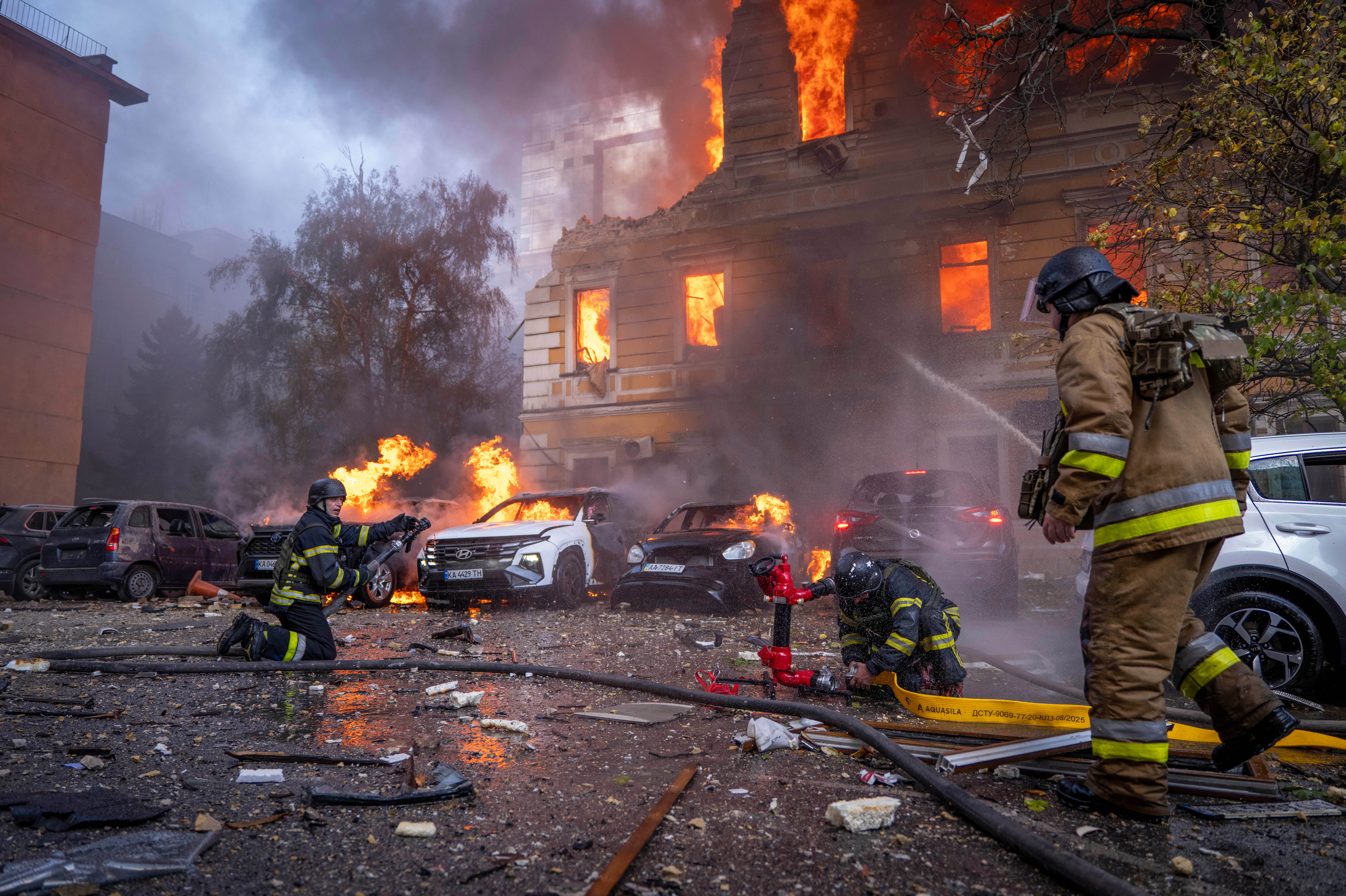 Rescue workers put out a fire at the National Academy of Sciences building following a Russian drone strike in the centre of Kyiv, Ukraine, on Monday, September 28, 2026
