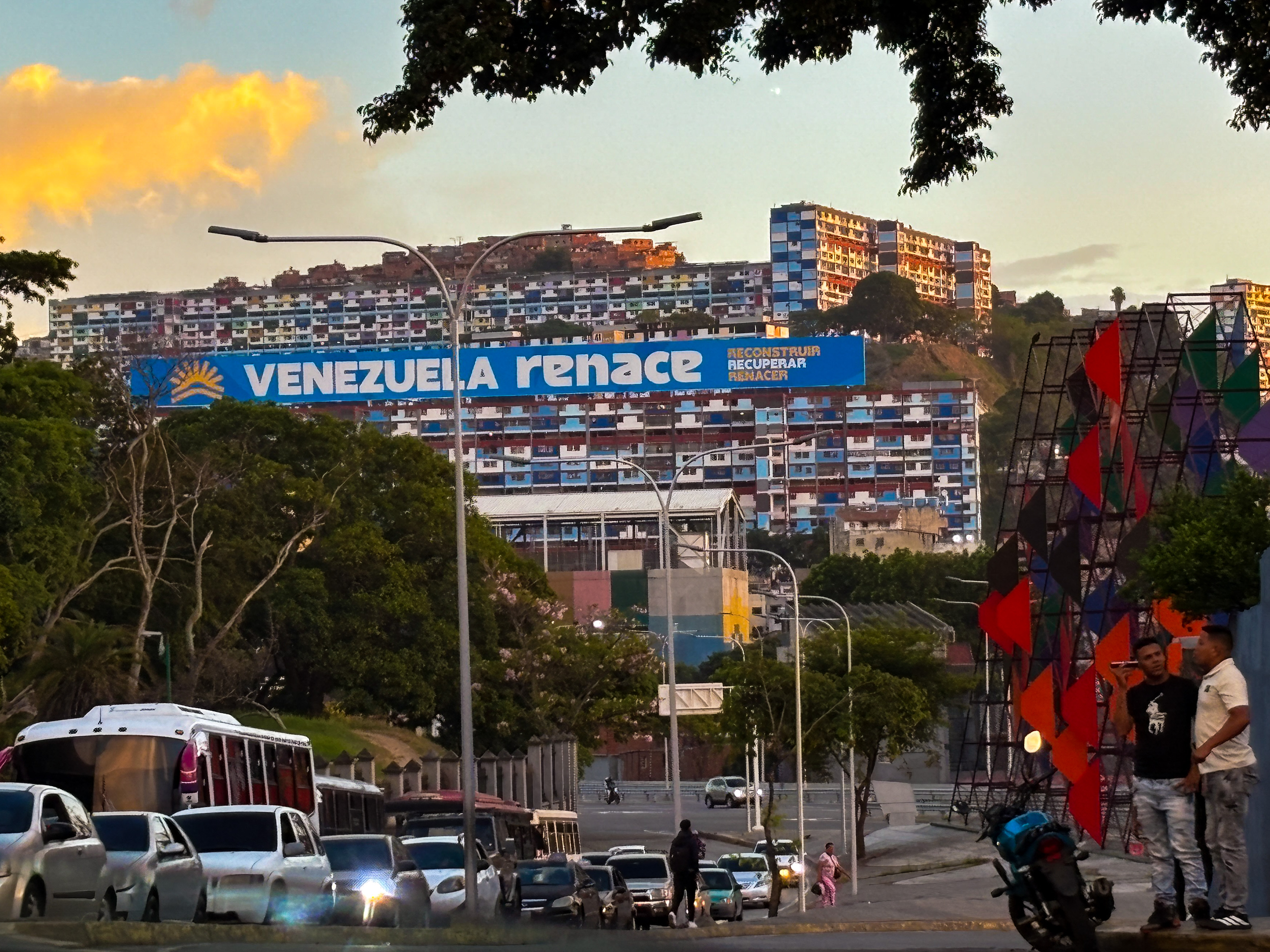 Murals and billboards are spreading across Caracas with the phrase translated to English as Venezuela reborn including on government housing complexes