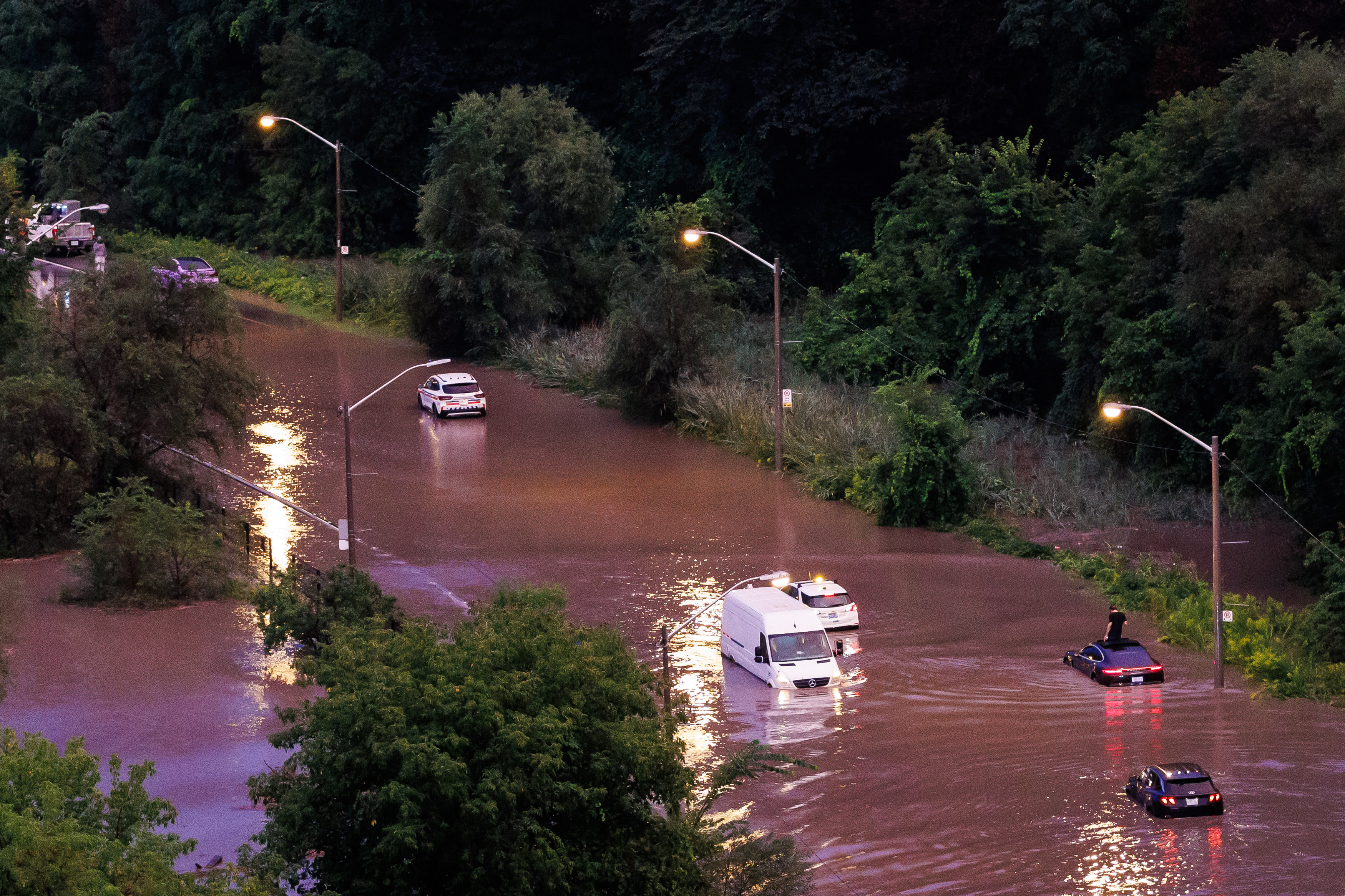 Cars sit stranded on the flooded Don Valley Parkway during a storm in Toronto on Wednesday, Sept. 2, 2026. [Keito Newman/THE CANADIAN PRESS]