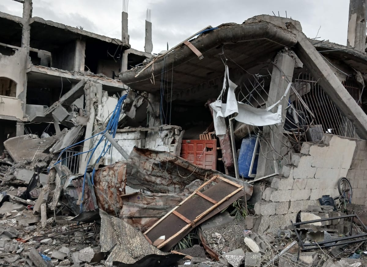 The destroyed home of Hala and her husband Muhannad. Just two weeks after their wedding, the couple were forced to evacuate before an airstrike turned their house and wedding belongings into rubble [Hala Al-khatib/Al Jazeera]