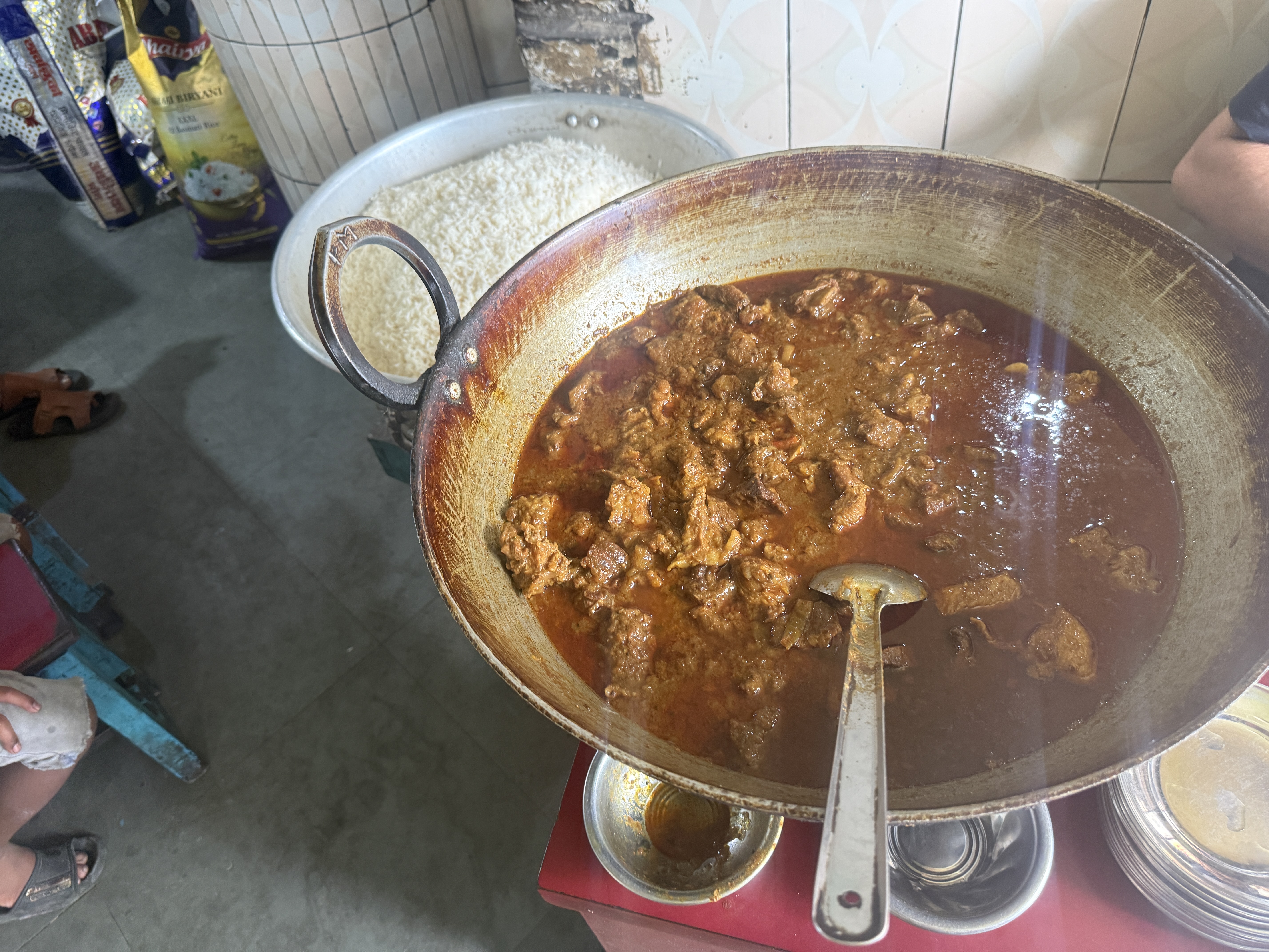 Beef curry and rice, at a small roadside stall opposite the Tangra slaughterhouse [Arshia/ Al Jazeera]