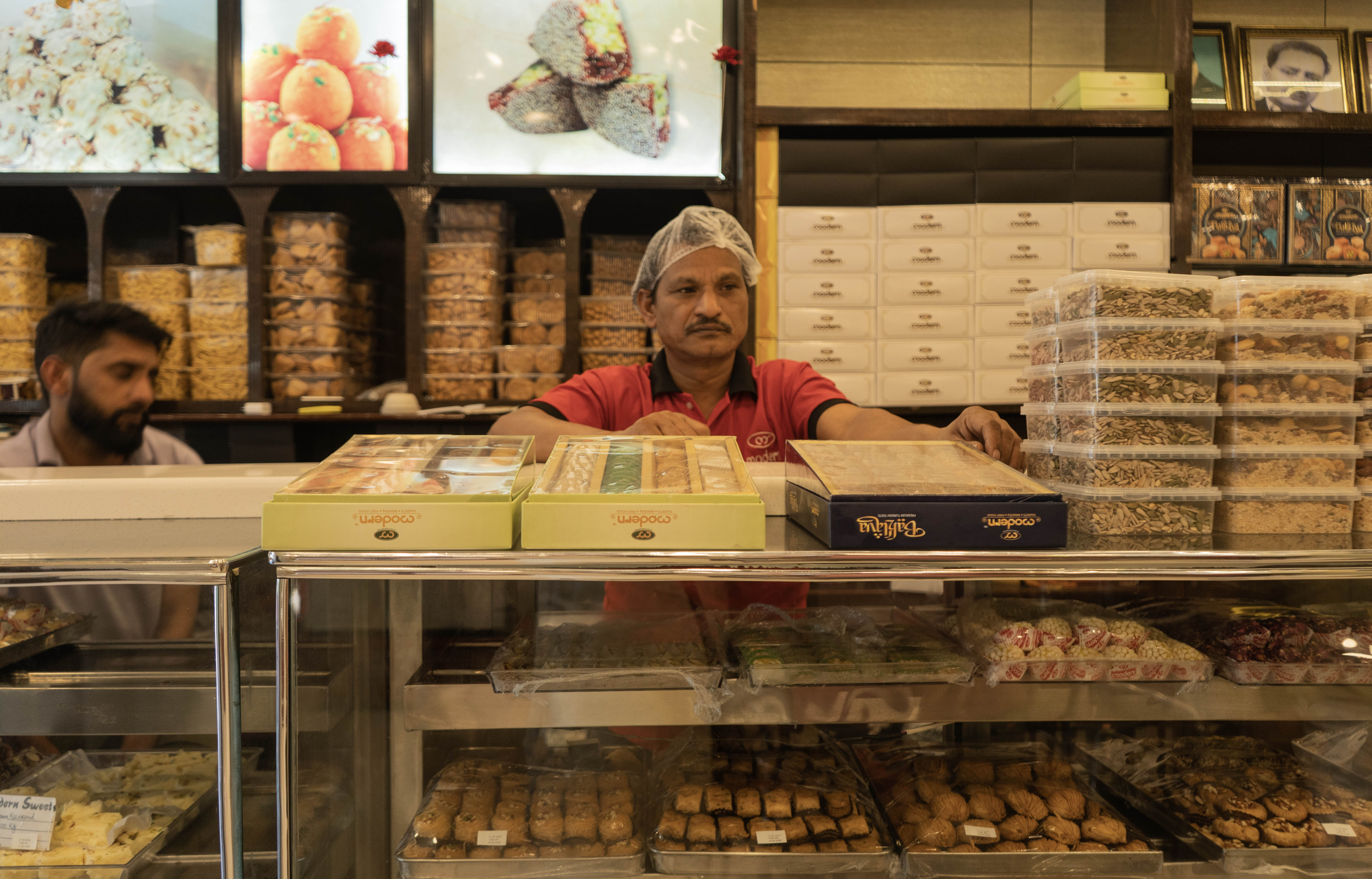 India’s sweets sector is worth more than $1.1 billion, with festive-season sales accounting for more than 40 percent of annual revenue. During Hindu festivals such as Diwali, sweets are widely exchanged as gifts and offered as prasad at temples and religious ceremonies. (Picture by Wasim Nabi for Al Jazeera)