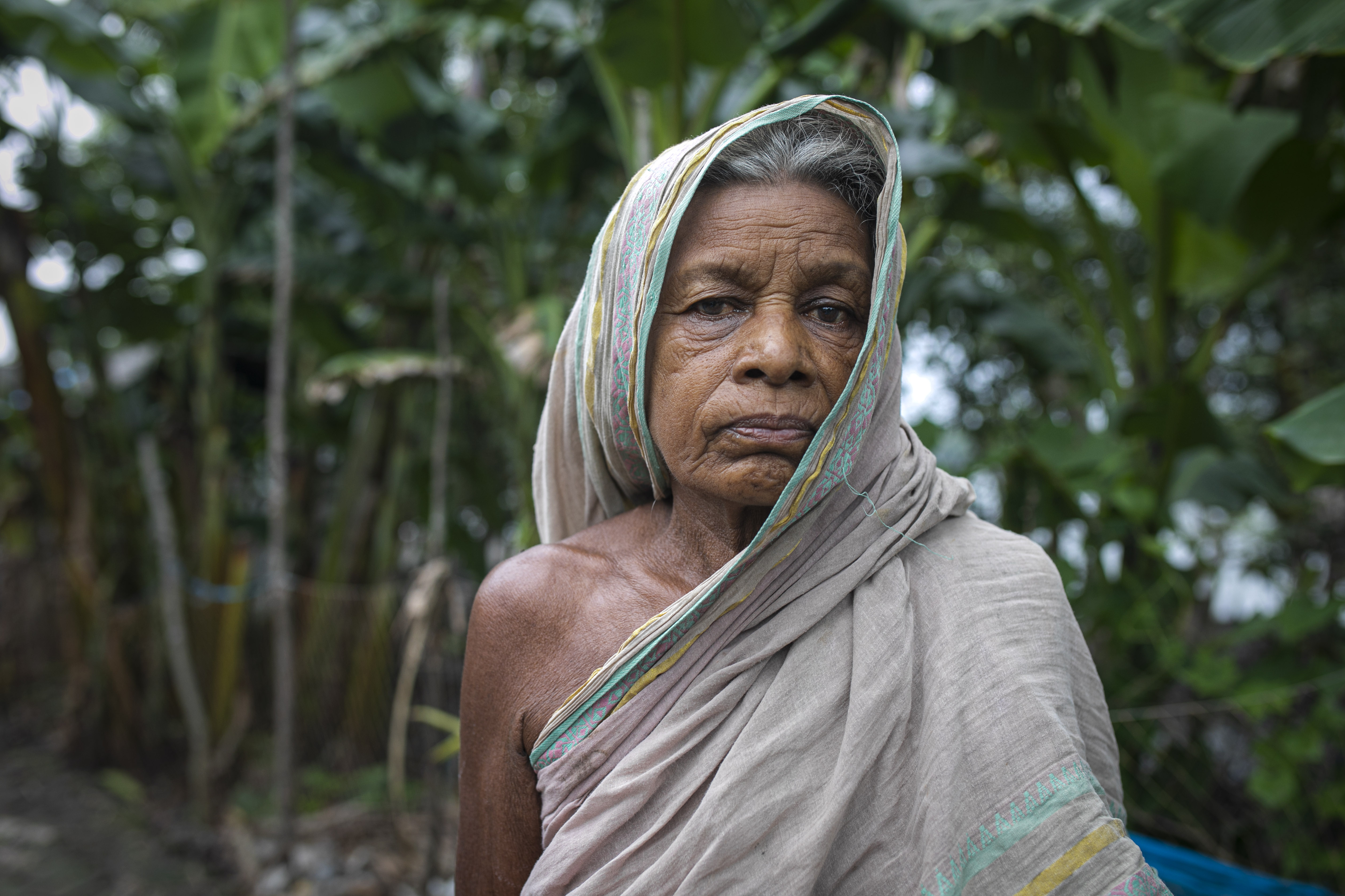 Suvodra Mondal, 80, relies on medicinal remedies prepared by her nephew Suranjan Raptan to help ease her joint pain and other ailments