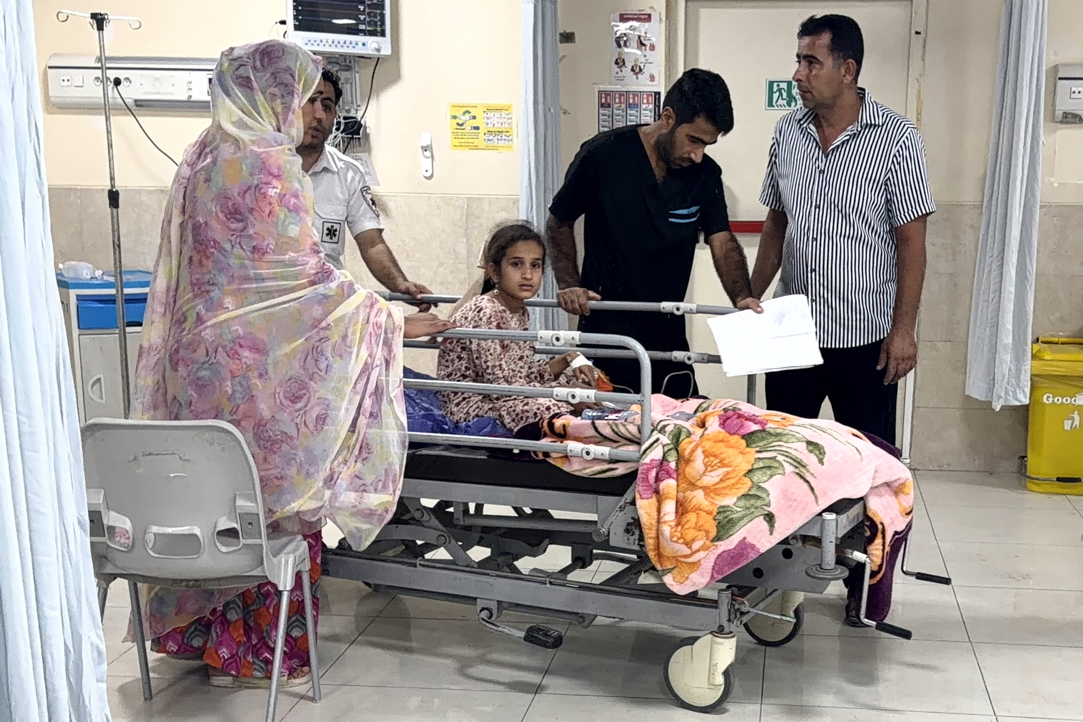 EDITORS NOTE: Graphic content / In this picture obtained by AFP from the Iranian news agency Tasnim on September 2, 2026 a child sits on a hospital bed at a trauma ward following injuries from an overnight strike in Kuhestak, Sirik County, in Iran's southern Hormozgan province on September 2, 2026.