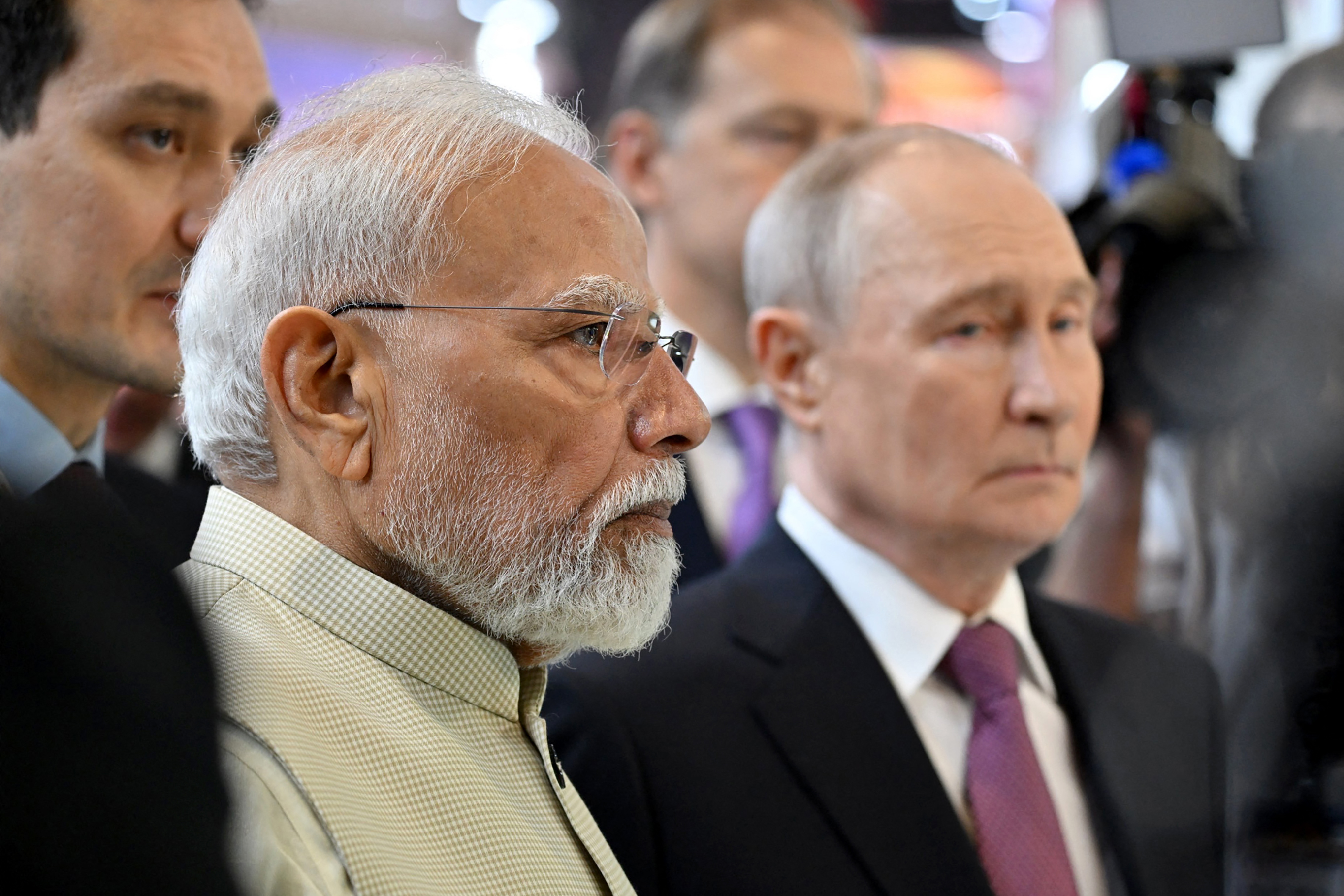 This handout photograph taken and released by the Indian Press Information Bureau (PIB) on September 11, 2026 shows India's Prime Minister Narendra Modi and Russia's President Vladimir Putin at an exhibition on the sidelines of the BRICS Summit in New Delhi.