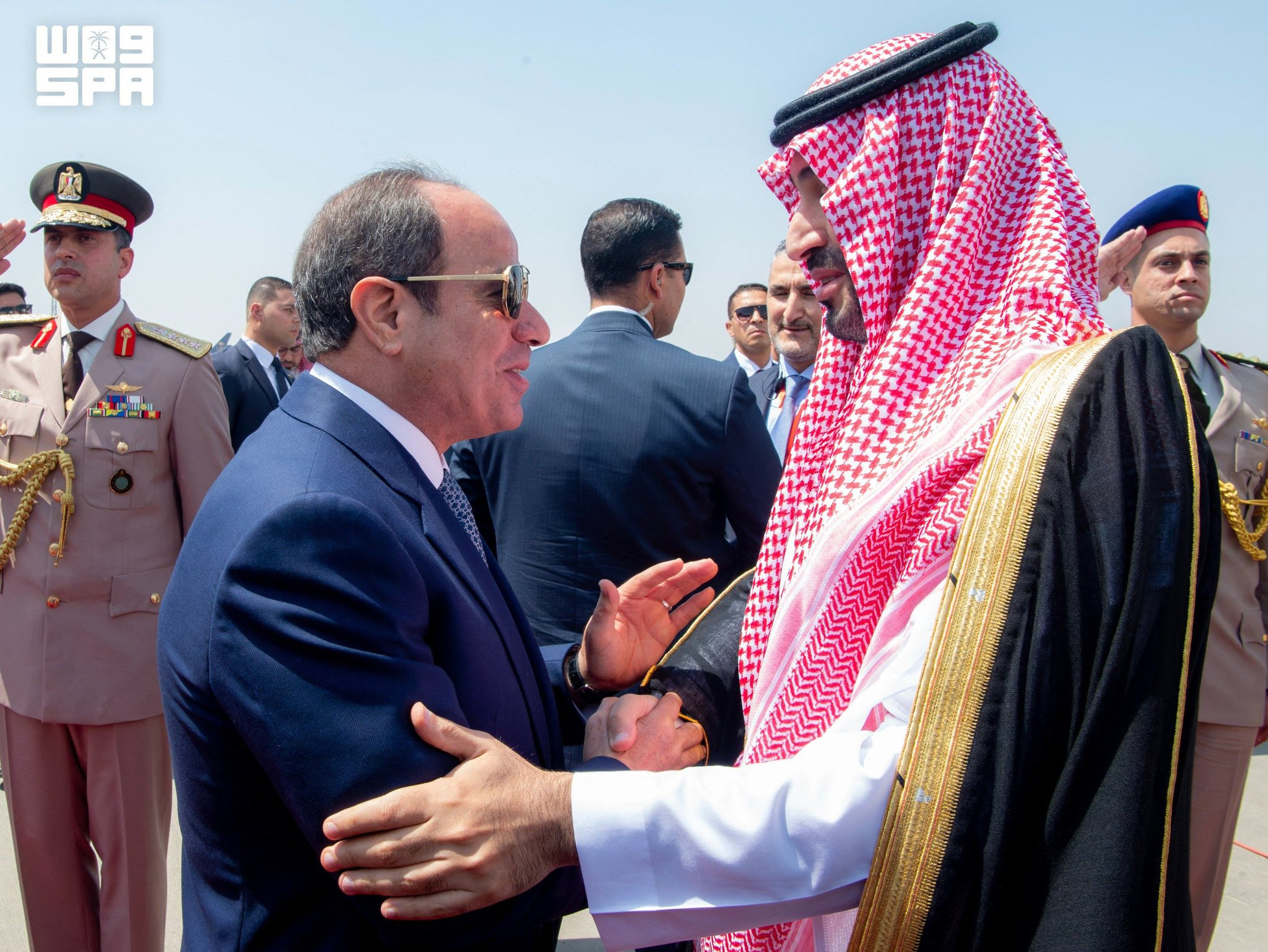 A handout picture provided by the Saudi Press Agency (SPA) on September 15, 2026, shows Egyptian President Abdel Fattah al-Sisi (L) shaking hands with Saudi de facto ruler Crown Prince Mohammed bin Salman during a welcoming ceremony at Cairo's International airport on September 15, 2026.