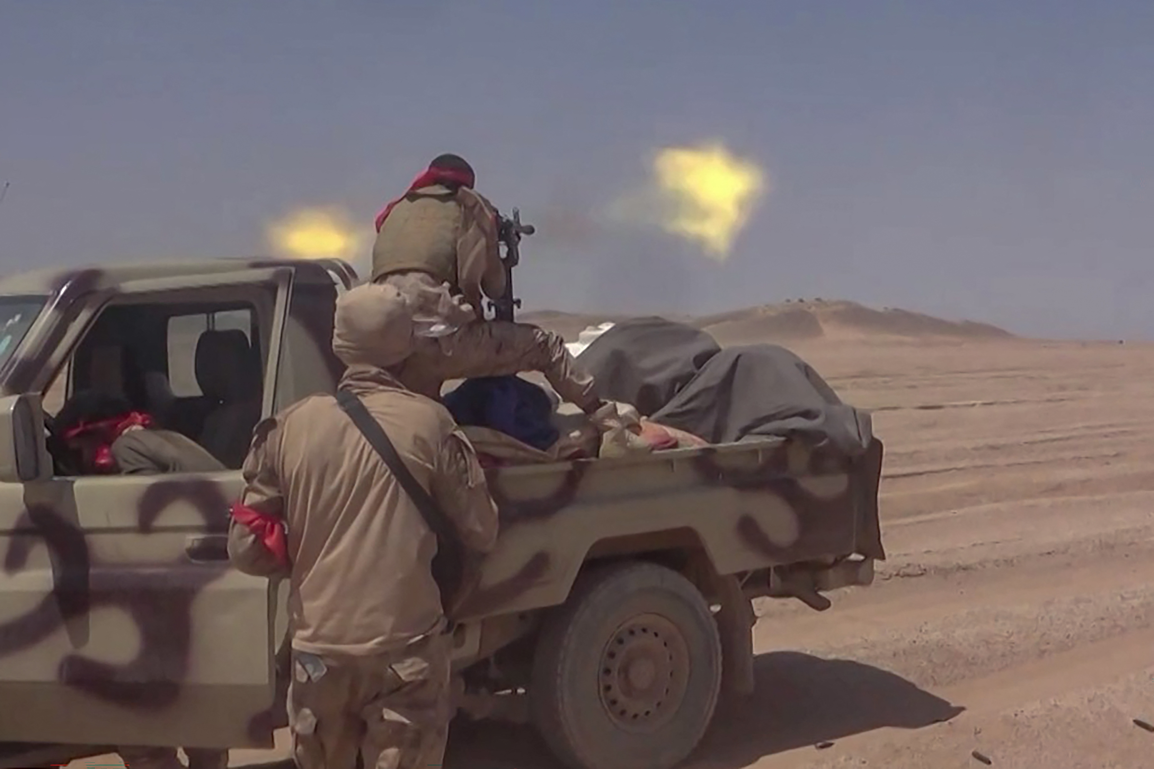 TOPSHOT - This frame grab taken from AFPTV video footage shows fighters affiliated with the Saudi-backed Yemeni government engaging in clashes with Houthi authorities in Al-Jawf province on September 15, 2026.