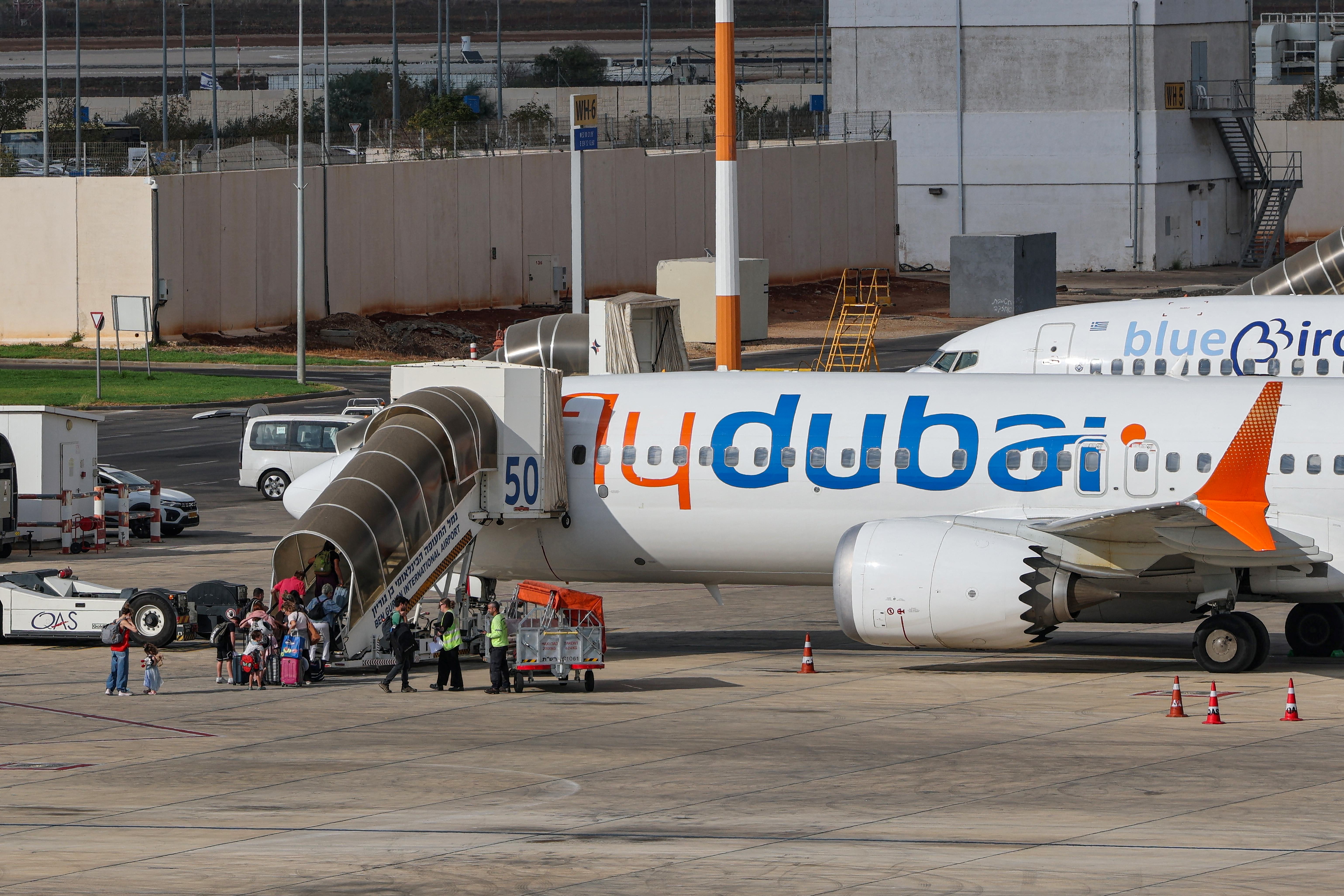 Passengers board a flydubai flight, bound for Dubai, before taking off from Ben Gurion Airport near Tel Aviv on September 30, 2026.