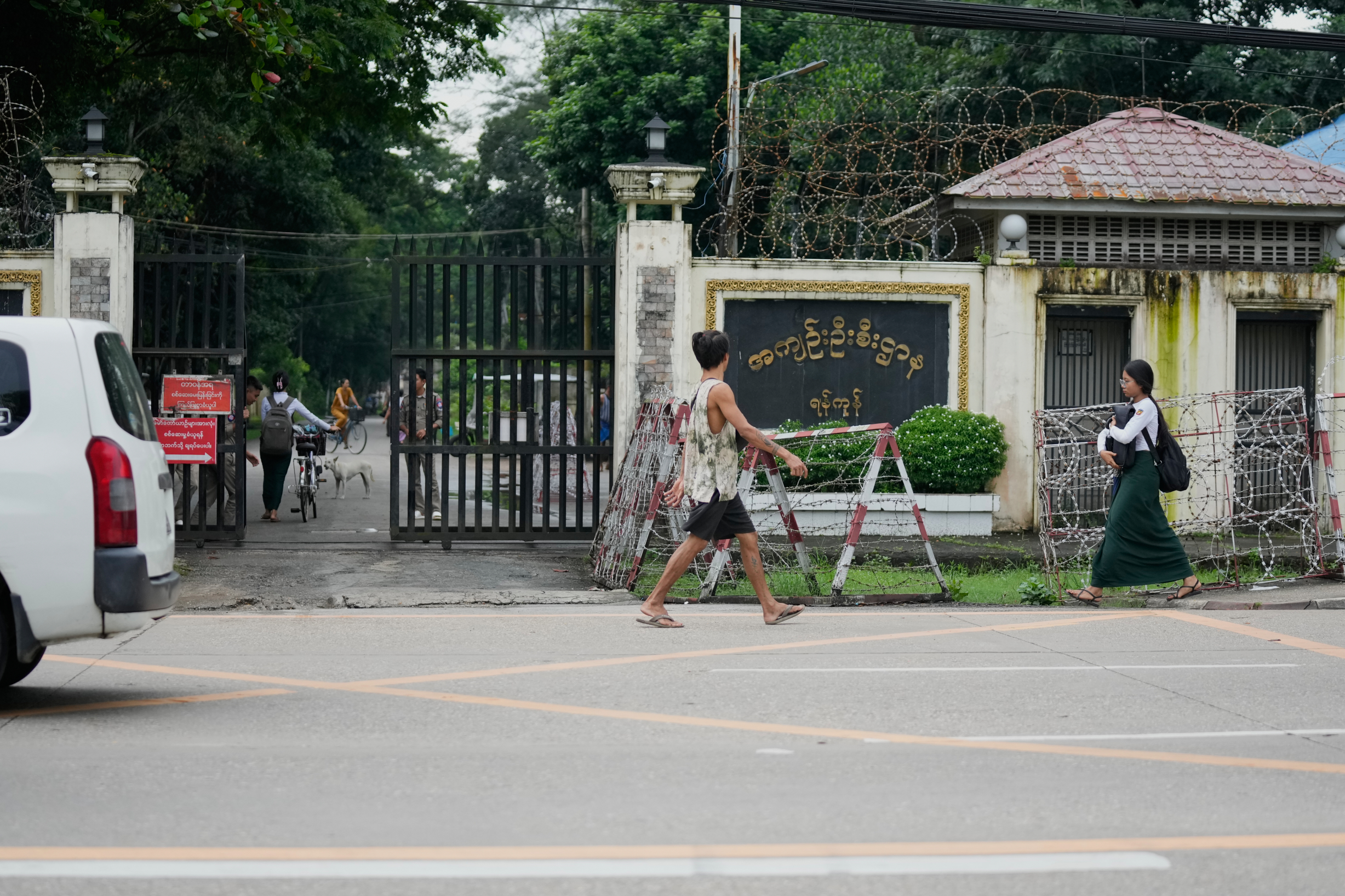 Pedestrians walk past entrance of Insein prison Tuesday, Sept. 15, 2026, in Yangon, Myanmar. (AP Photo)