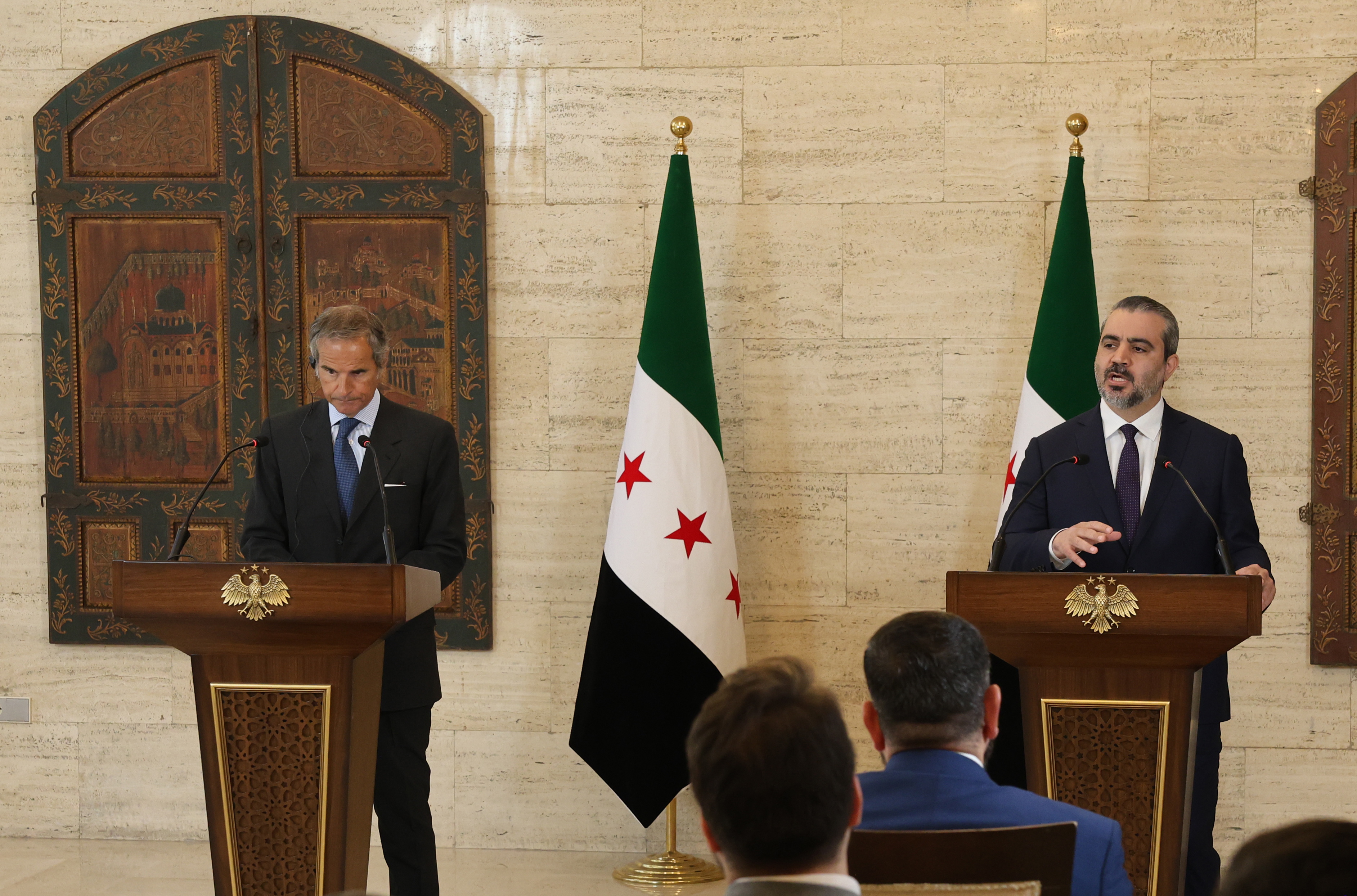 Syrian Foreign Minister Asaad Al-Shaibani (R) speaks during a joint press conference with Rafael Grossi (L), director general of the International Atomic Energy Agency (IAEA), in the former presidential Tishreen Palace in Damascus, Syria, 18 August 2026. EPA/MOHAMED AL RIFAI
