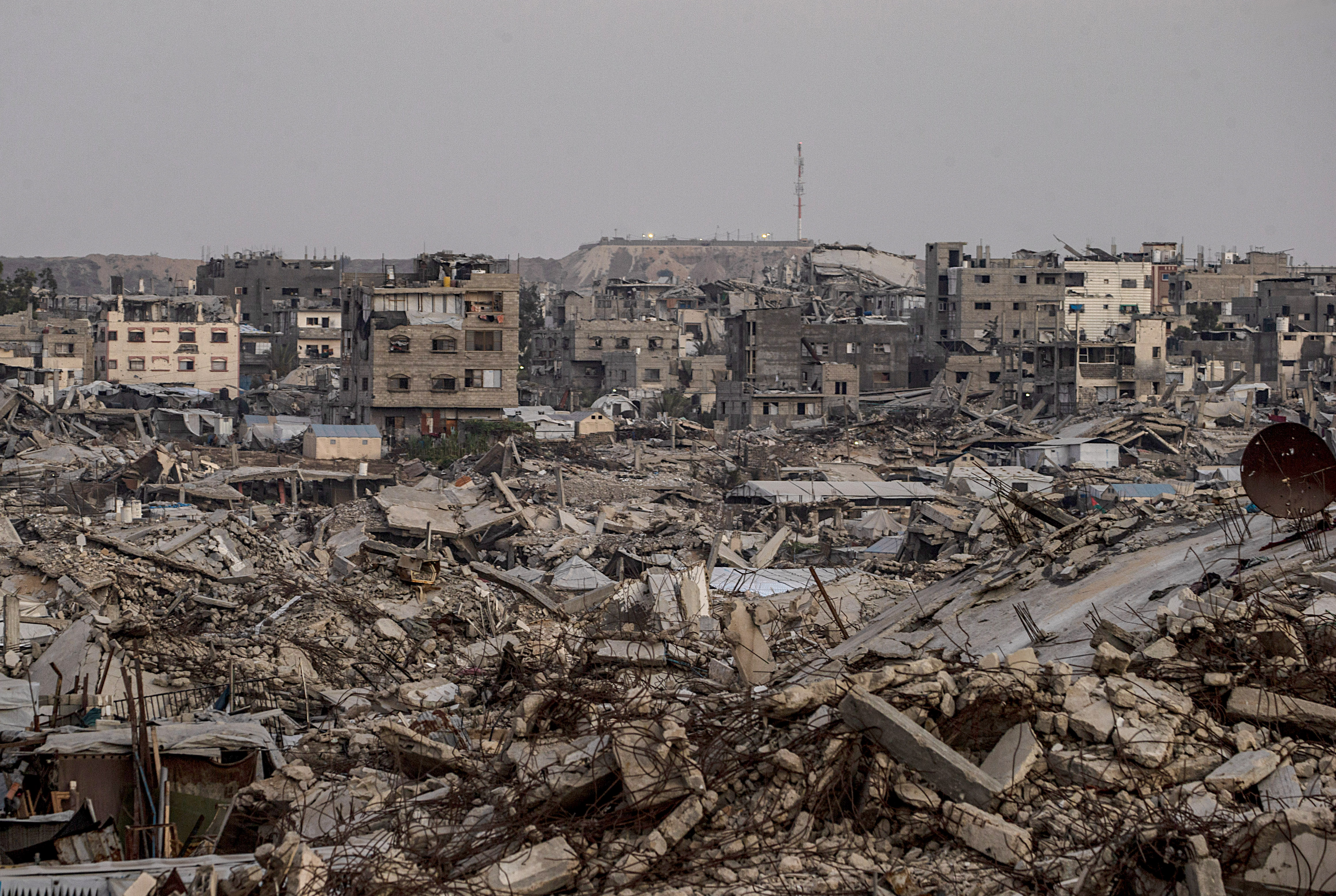 An Israeli military site is seen in the background behind destroyed residential buildings in the al-Sheikh Radwan neighbourhood, east of Gaza City, on September 10, 2026