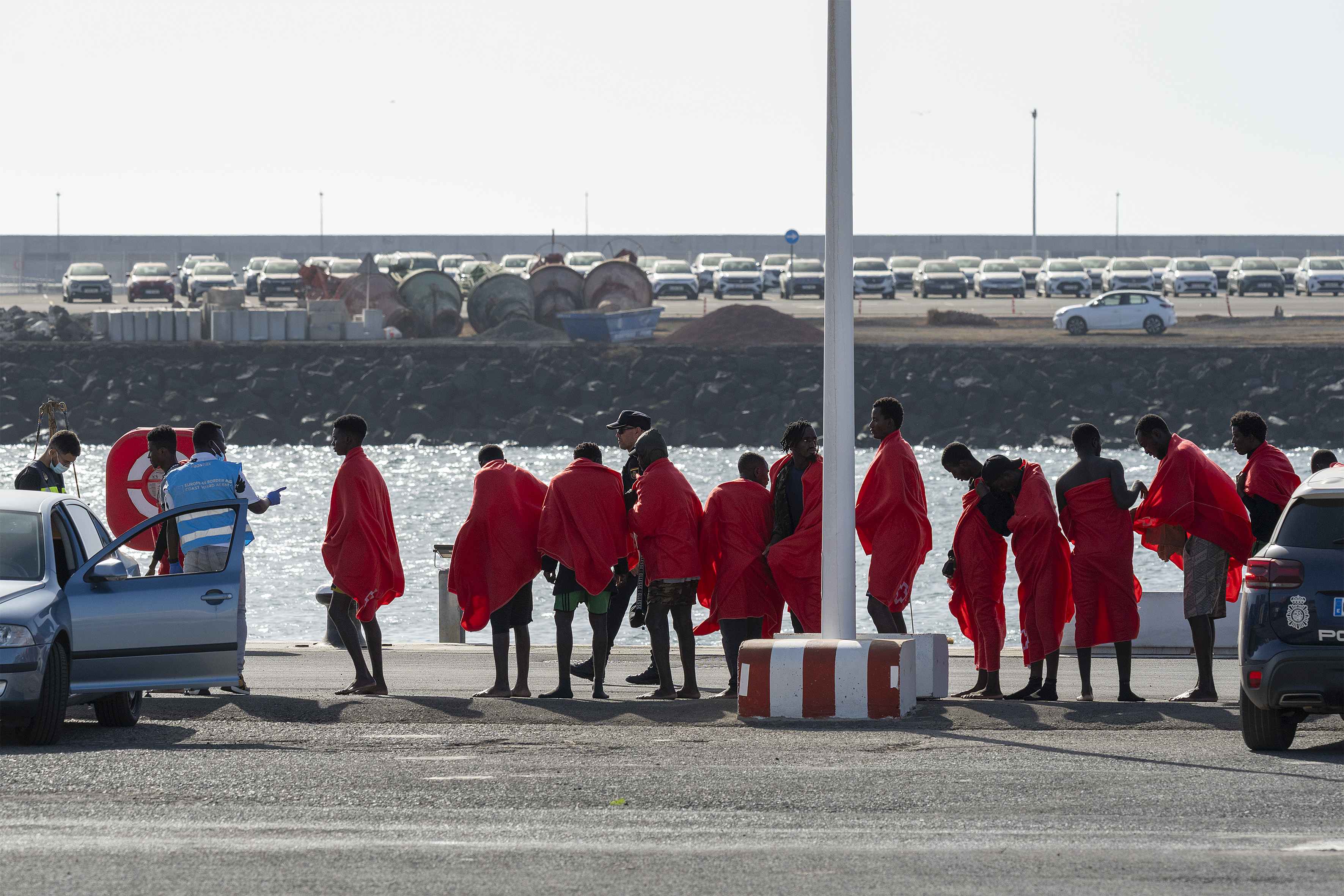 epa13243574 Some of the immigrants rescued at sea, after arrival at the dock of Arrecife, Lanzarote island, Spain, 16 September 2026. The Spanish Maritime Rescue Society rescued 82 people from an inflatable dinghy 131 kilometers from Lanzarote in the Canary Islands. Three people died aboard the dinghy and another one remains in a critical condition. EPA/Adriel Perdomo