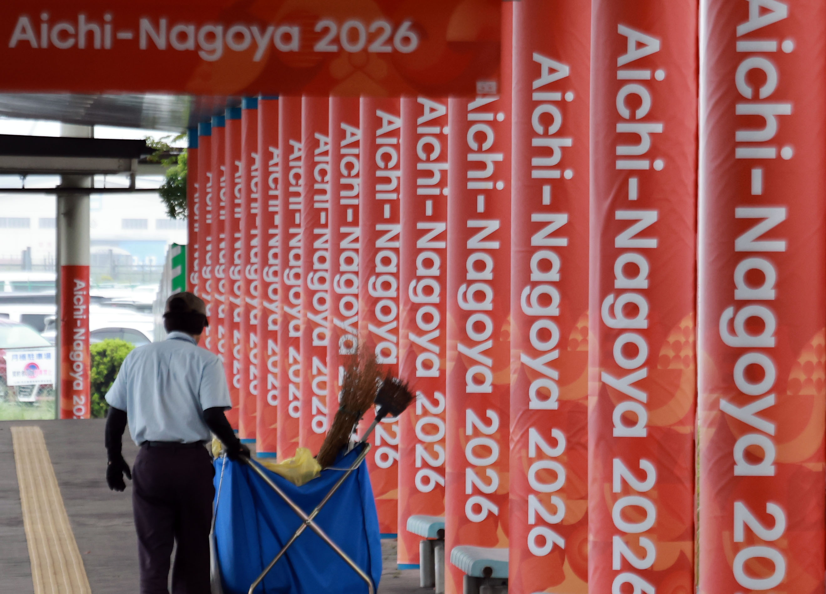 epa13230424 A worker cleans the area outside the main media center for the 20th Asian Games in Nagoya, Aichi Prefecture, central Japan, 11 September 2026, ahead of the sports event running from 19 September to 04 October. EPA/YONHAP SOUTH KOREA OUT