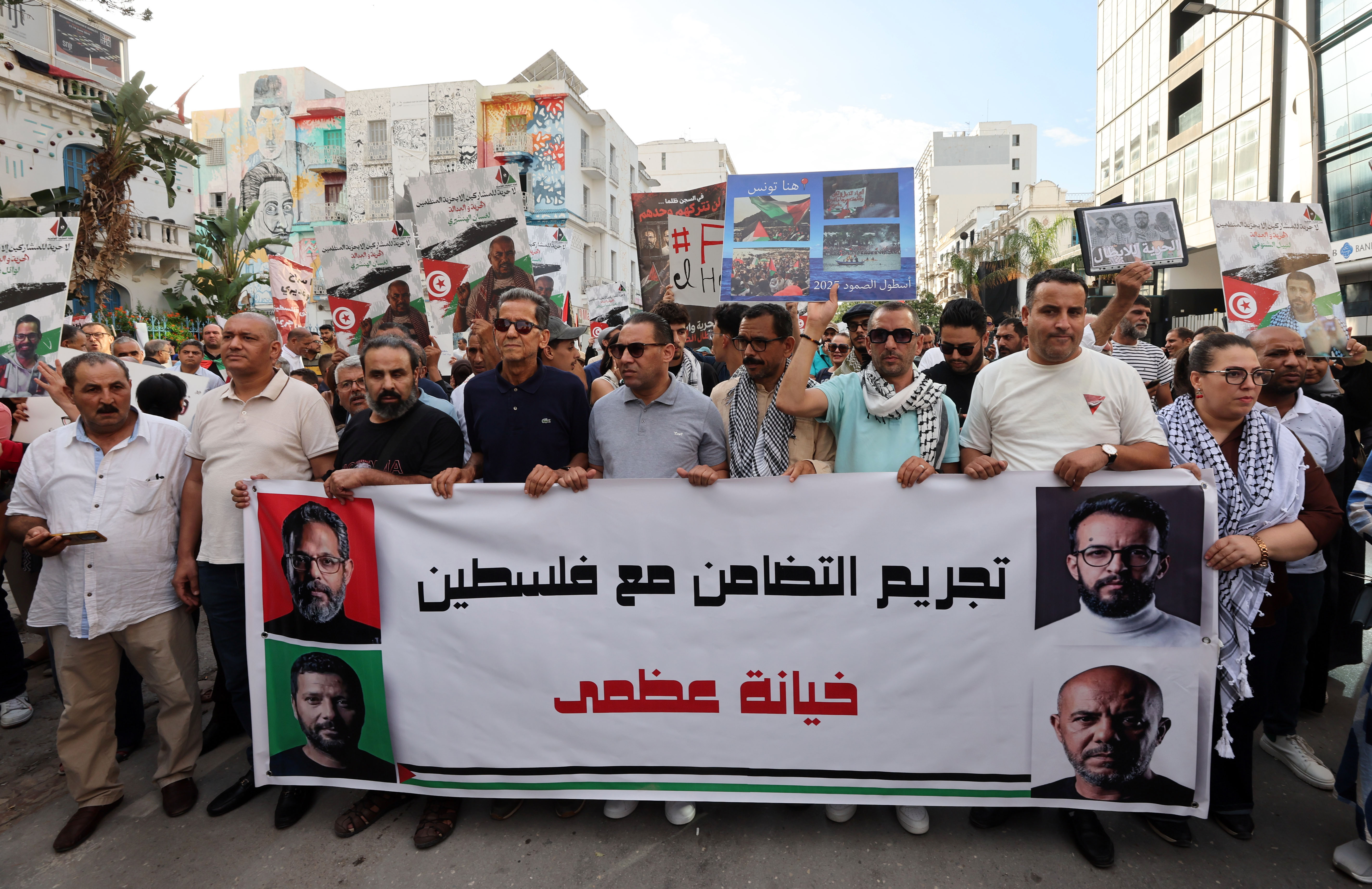epa13250663 Tunisians chant slogans in support of four Tunisian members of the Sumud Flotilla, Wael Naouar, Ghassan Henchiri, Ghassan Boughdiri, and Nabil Chennoufi during a demonstration organized by the Tunisian Republican Party in Tunis, Tunisia, 19 September 2026. The four members of the flotilla's leadership are detained at Mornaguia prison in pretrial detention since March 2026 as part of an investigation by the Economic and Financial Judicial Pole. A statement demanding their release and denouncing the criminalization of solidarity with the Palestinian people was signed by several associations. EPA/MOHAMED MESSARA