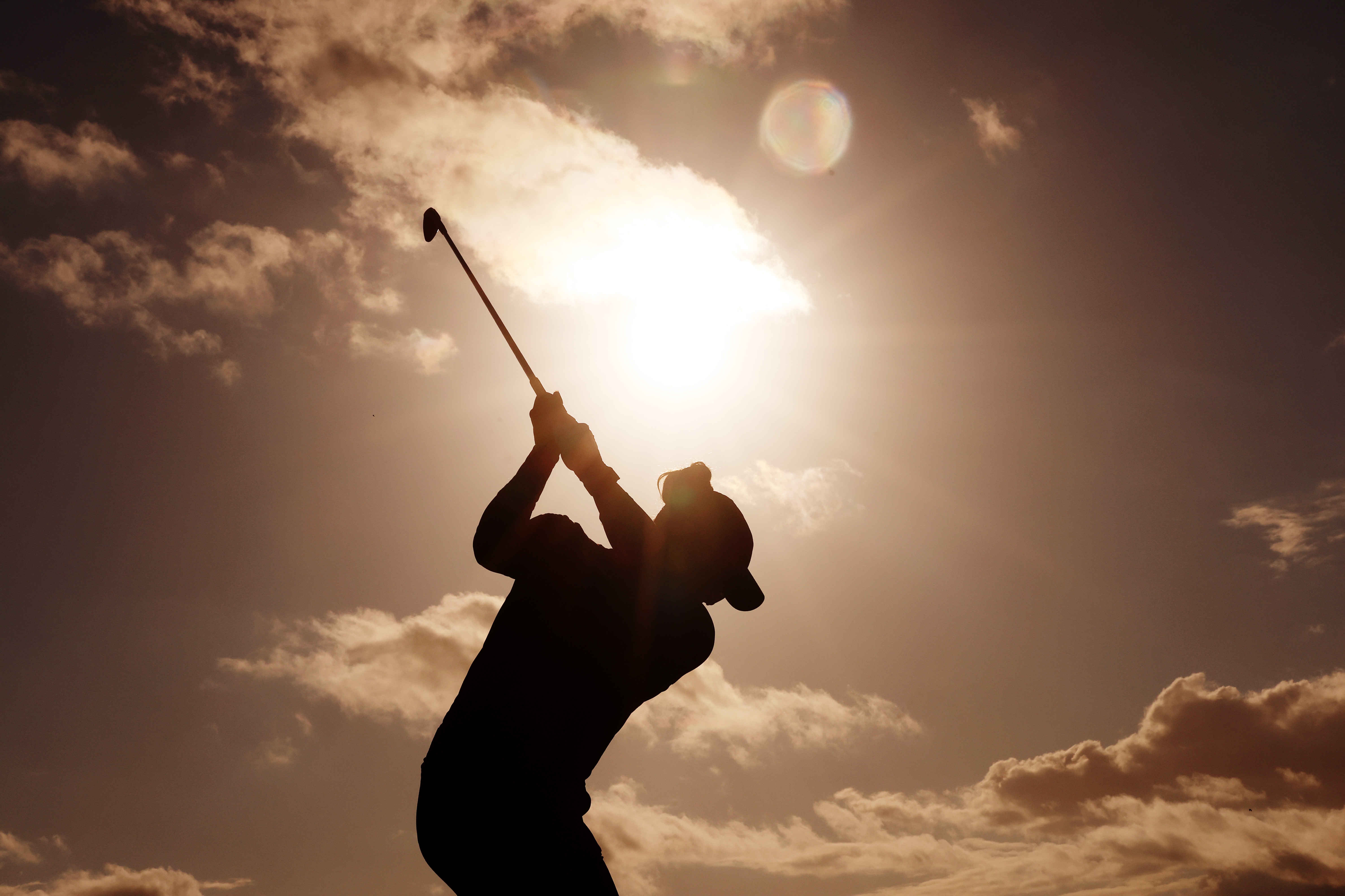 A silhouette as Gaby Lopez of Mexico plays a shot.