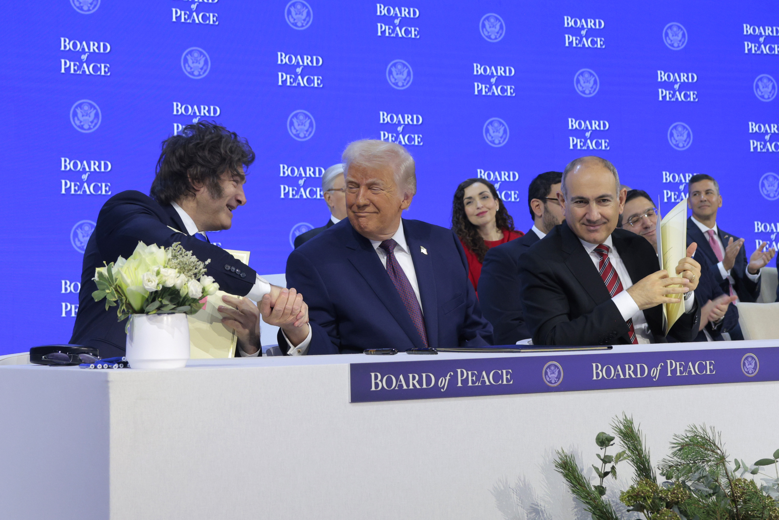 DAVOS, SWITZERLAND - JANUARY 22: U.S. President Donald Trump shakes hands with President of Argentina Javier Milei during a signing ceremony for the “Board of Peace” at the World Economic Forum (WEF) on January 22, 2026 in Davos, Switzerland. The US-backed “Board of Peace” is intended to administer the fragile ceasefire in the Gaza Strip after the war between Israel and Hamas. The final makeup of the board has not been confirmed. (Photo by Chip Somodevilla/Getty Images)