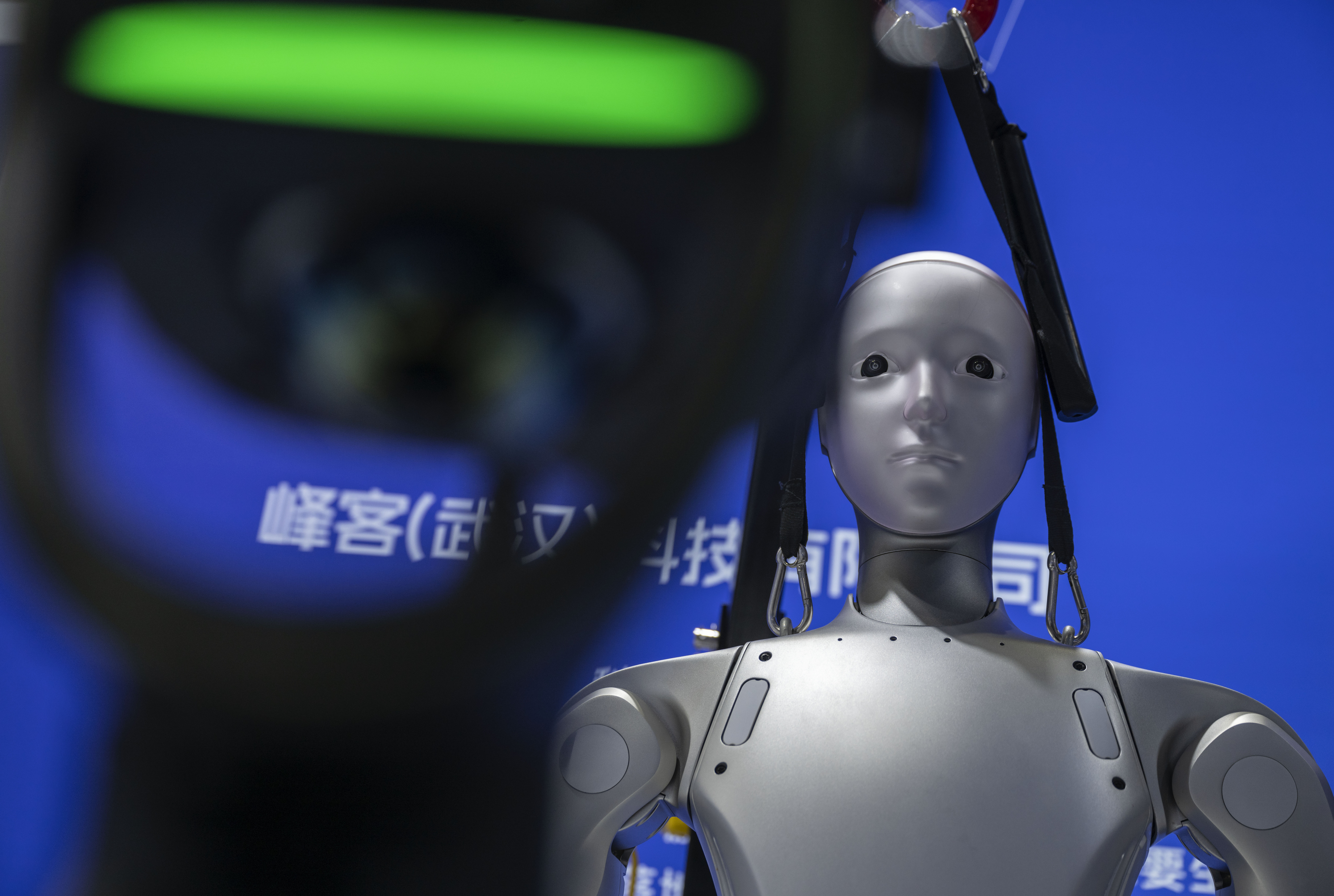 BEIJING, CHINA - JUNE 26: A humanoid robot is seen at a display at the Chinese International Supply Chain Expo (CISCE) on June 26, 2026 in Beijing, China. China is investing heavily in artificial intelligence and robotics, pouring billions of dollars into what the government sees as the country’s next economic engine. There are thousands of Chinese companies across a sprawling sector that includes humanoid robot and embodied intelligence, AI models, factory automation, and AI for autonomous systems. China remains in a race with the United States for dominance in AI technologies with products that are cheaper to manufacture and have commercial appeal. (Photo by Kevin Frayer/Getty Images)