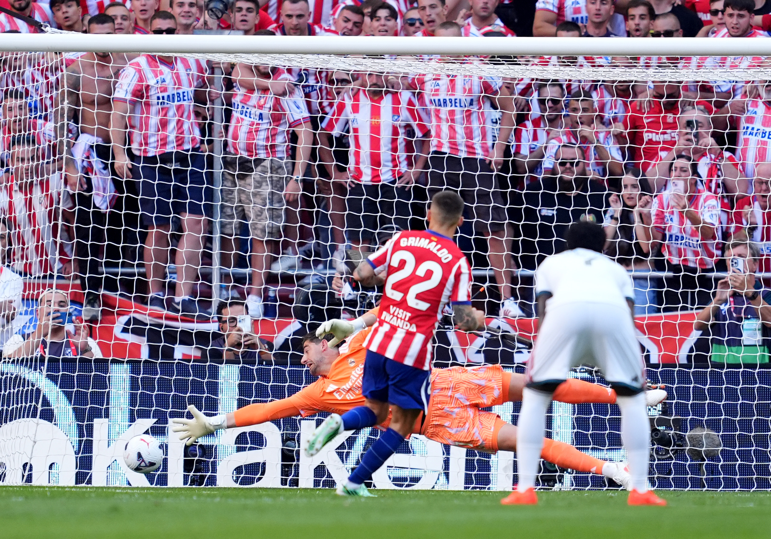MADRID, SPAIN - SEPTEMBER 20: Alex Grimaldo of Atletico Madrid scores his team’s first goal from the penalty spot past Thibaut Courtois of Real Madrid during the LaLiga EA Sports 2026/27 match between Atletico de Madrid and Real Madrid at Riyadh Air Metropolitano on September 20, 2026 in Madrid, Spain. (Photo by Mateo Villalba Sanchez/Getty Images)