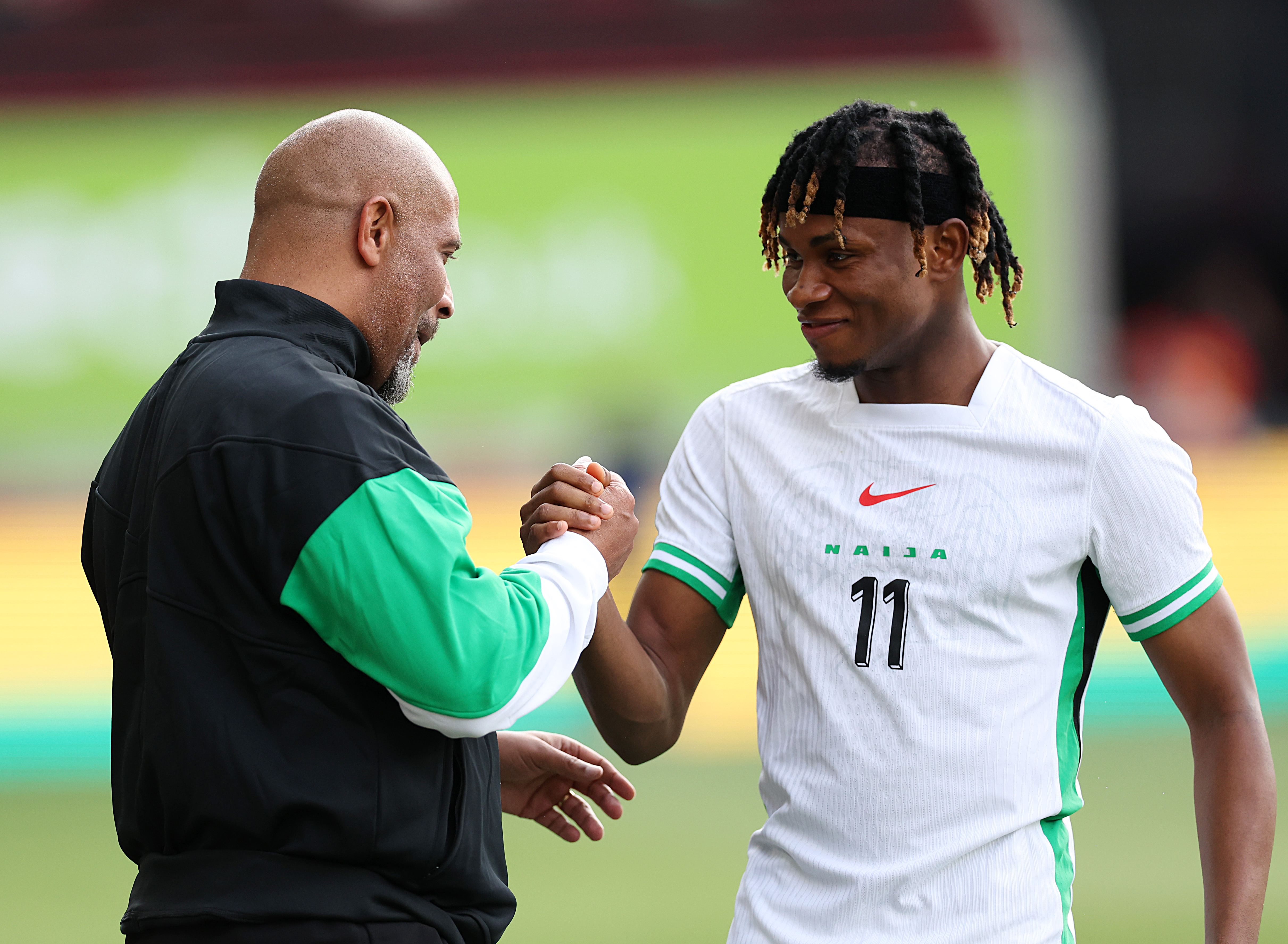 BRENTFORD, ENGLAND - MAY 31: Eric Chelle, head coach of Nigeria, and Samuel Chimerenka Chukwueze of Nigeria before before the Unity Cup Final match between Jamaica and Nigeria at Gtech Community Stadium on May 31, 2025 in Brentford, England. (Photo by Harry Murphy/Getty Images)