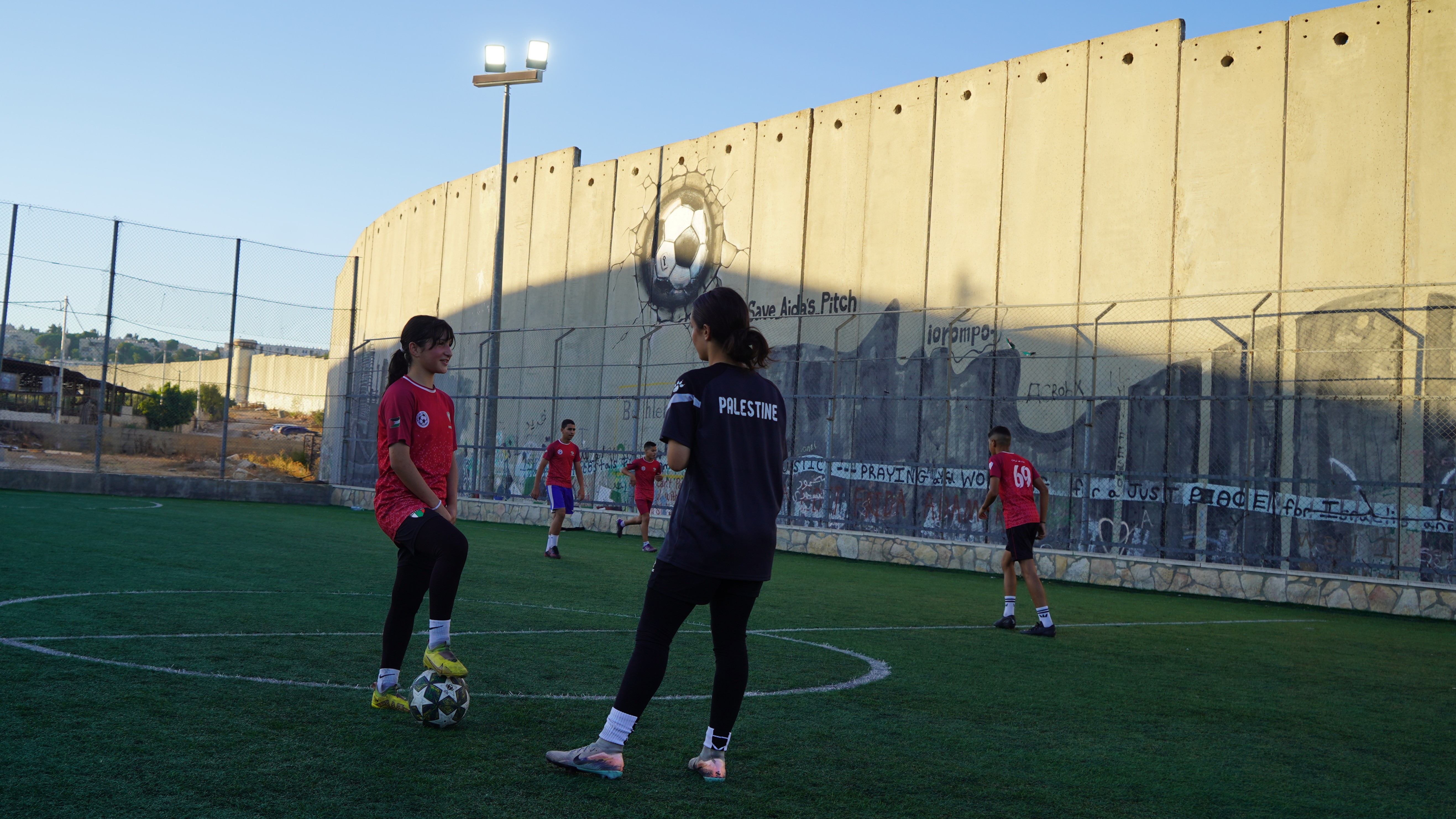 Young players practise at Aod Sports Academy in Aida refugee camp, in the shadow of Israel’s separation wall