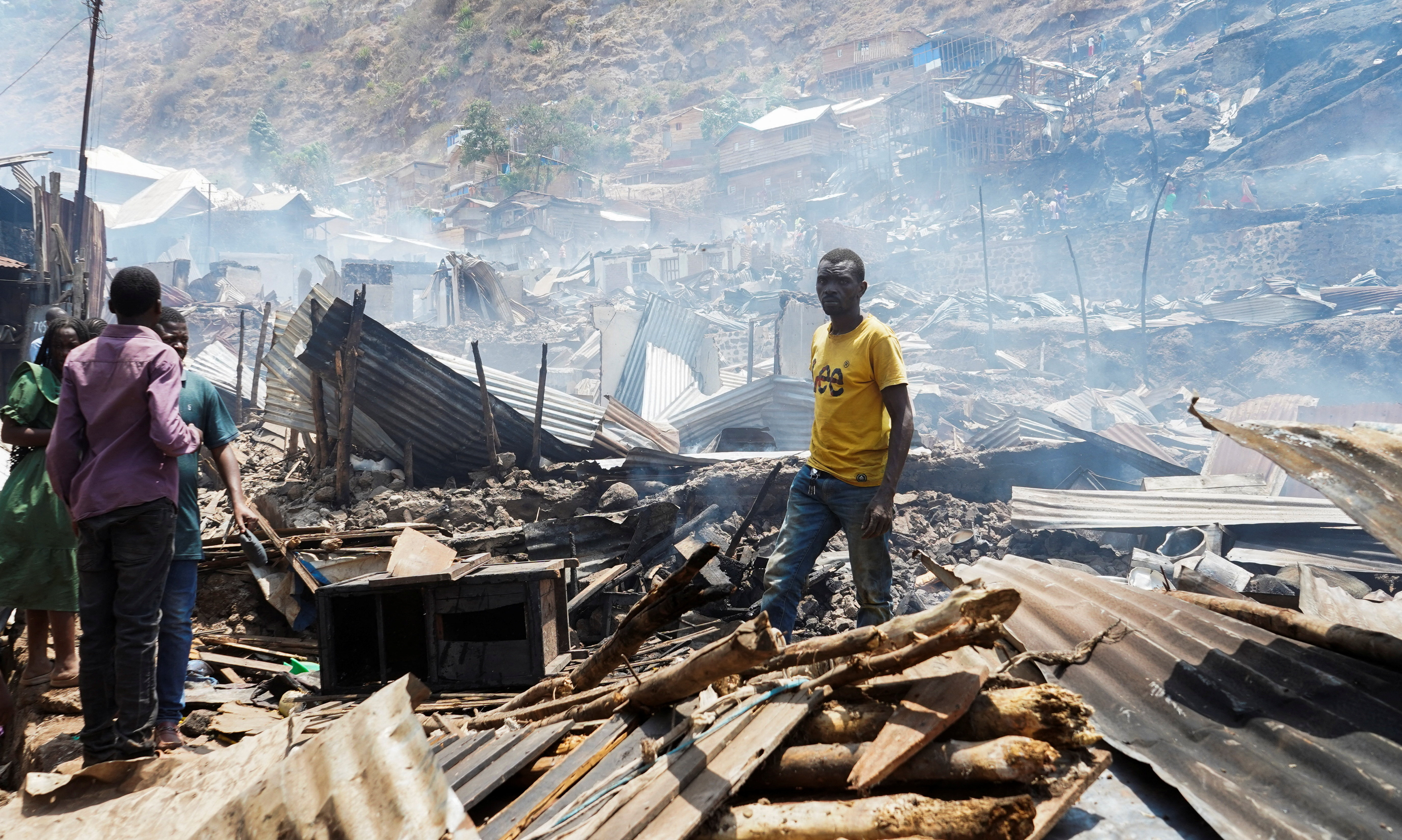 Congolese civilians gather to salvage their belongings from the ruins of a fire at a school and neighbouring settlement in the area controlled by Rwanda-backed AFC/M23 rebels since the group staged an offensive in eastern Congo in February 2025, in Bukavu, Democratic Republic of Congo, September 10, 2026. REUTERS/Victoire Mukenge