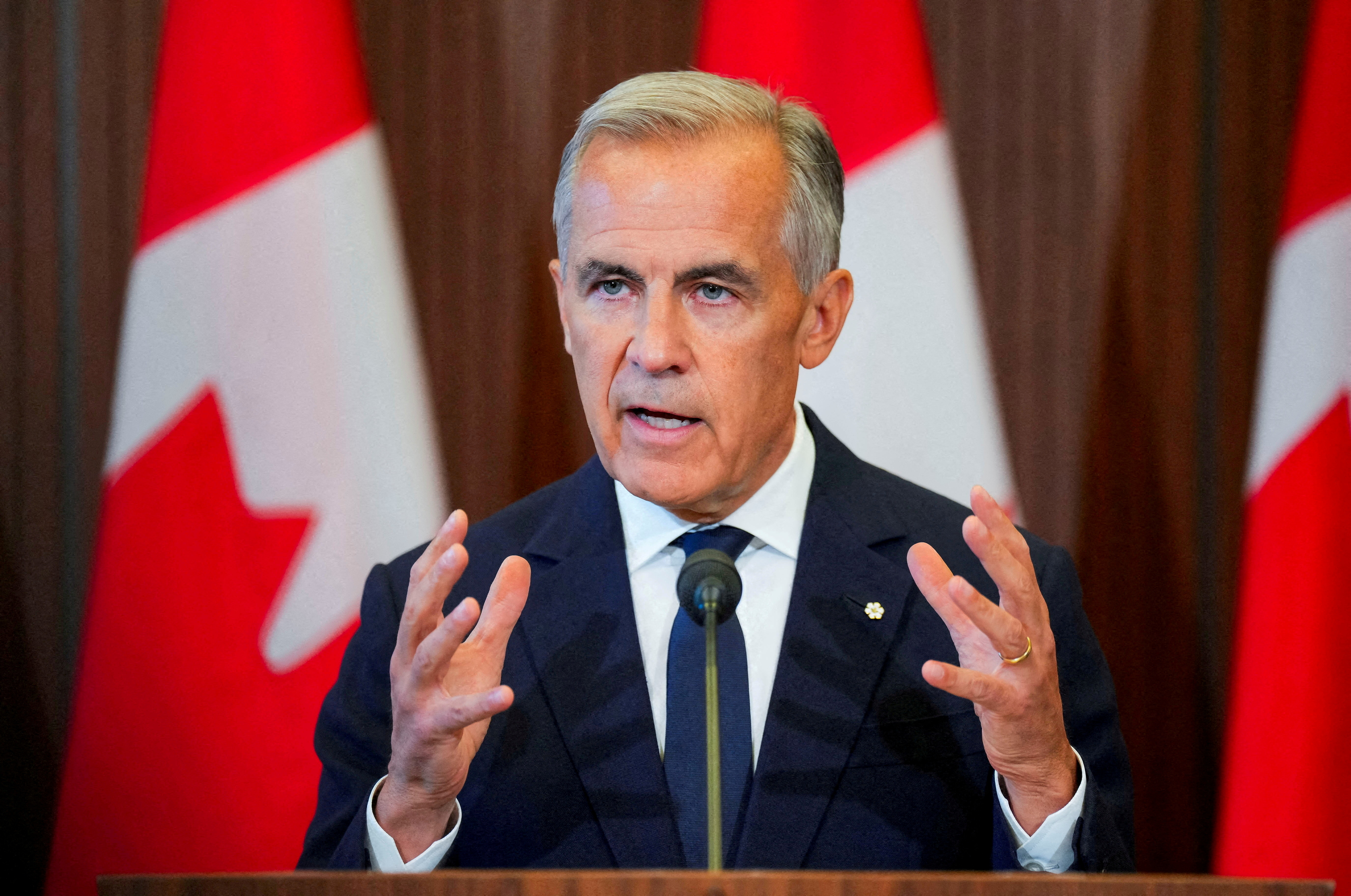 FILE PHOTO: Canada’s Prime Minister Mark Carney speaks with the news media after he suspended trade negotiations with the United States, in Ottawa, Ontario, Canada August 22, 2026. REUTERS/Chris Tanouye/File Photo