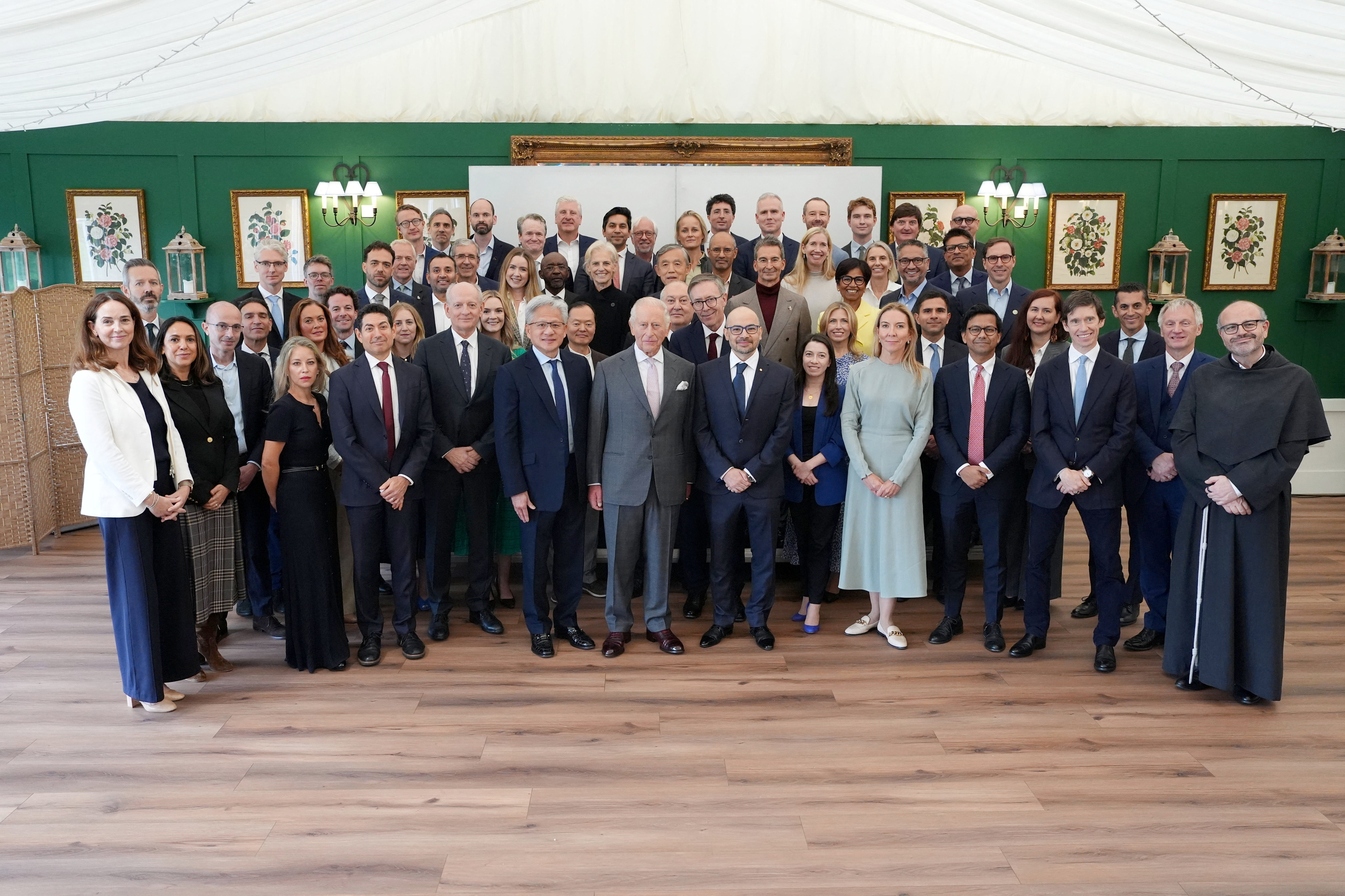 Britain's King Charles poses with attendees during a meeting for leaders from the artificial intelligence (AI) sector, Government, and thought leaders to discuss how AI can be developed and deployed in ways that benefit society, at Dumfries House in Cumnock, Britain, September 17, 2026. Jonathan Brady/Pool via REUTERS