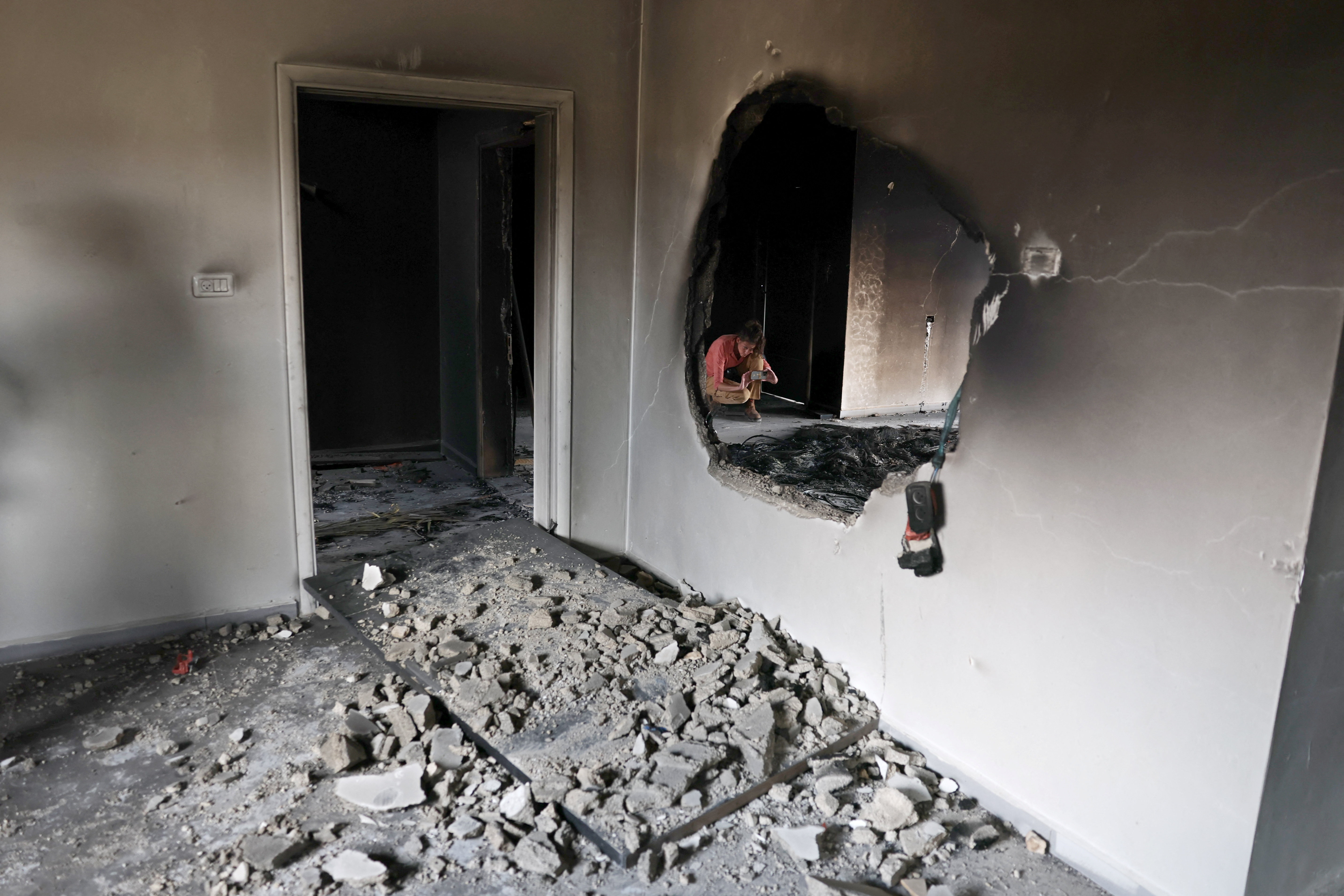 A journalist works in the estate of Palestinians Mahmod Tubasi, 60, and his wife Aedah, 51, which they say was attacked by Israeli settlers, in Jalud in the Israeli-occupied West Bank, September 29, 2026. REUTERS/Ammar Awad