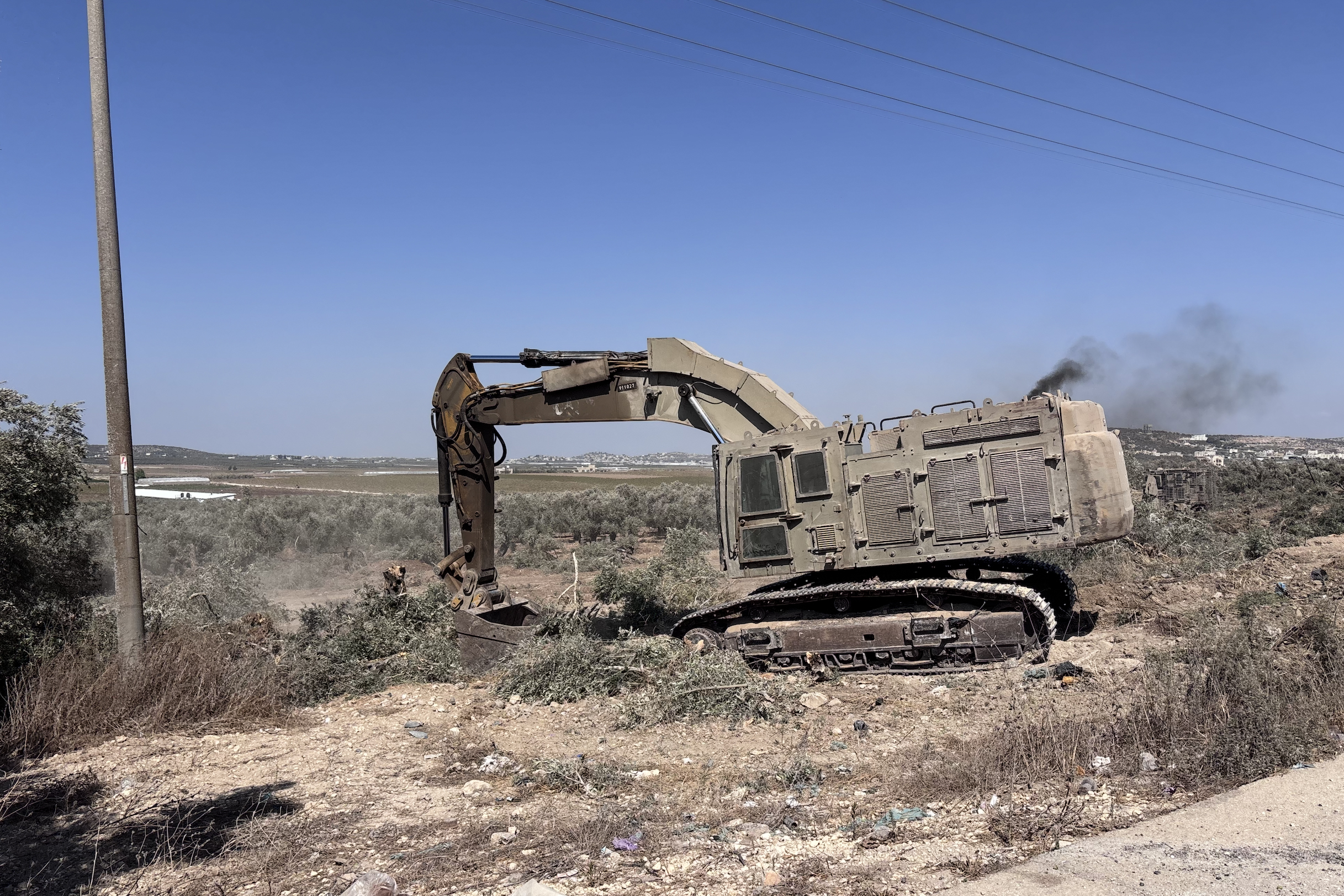 Israeli bulldozer destroying trees at a second location in Arraba at same time