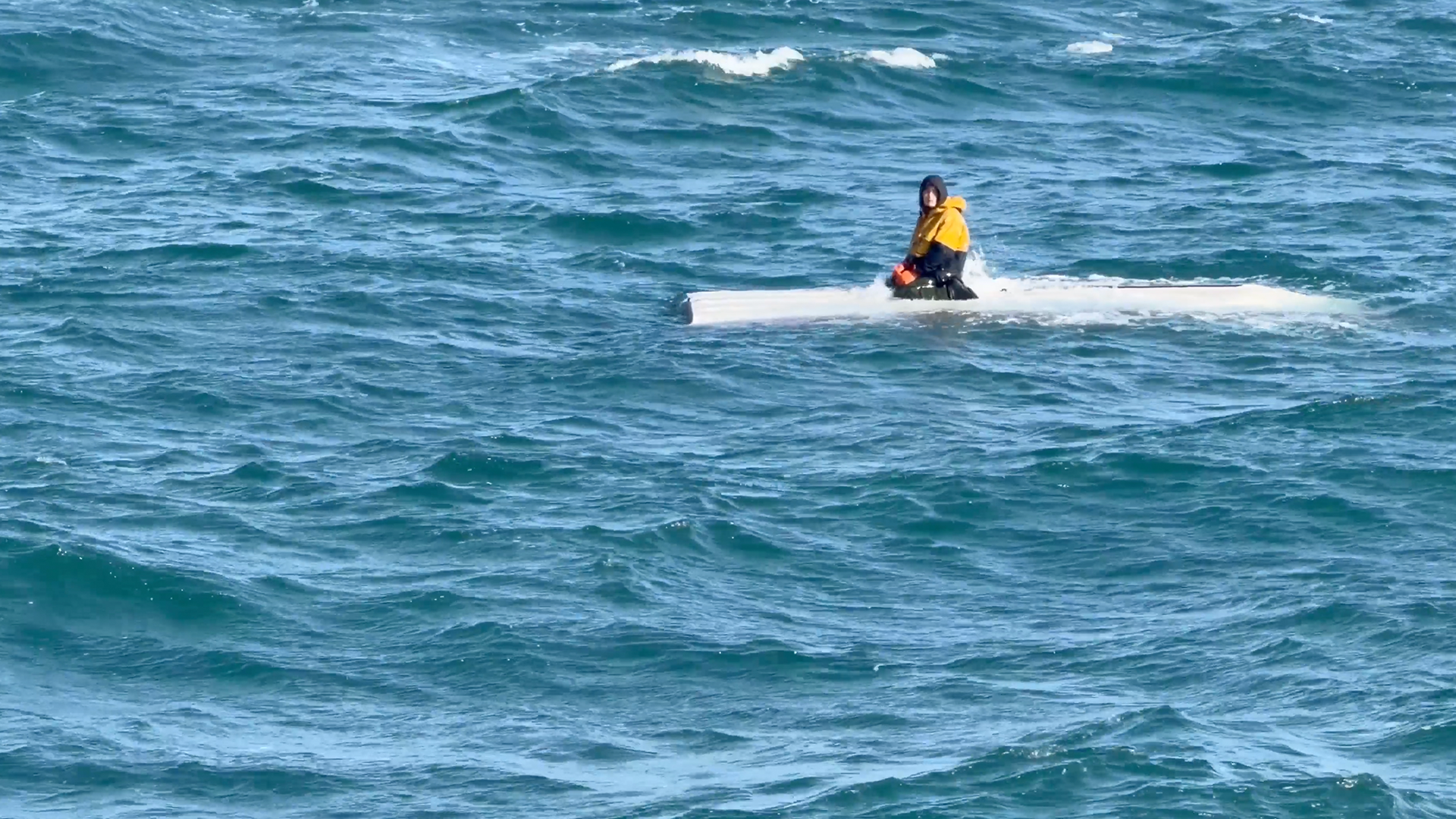 Teen rescued after clinging to boat for two days off Alaska