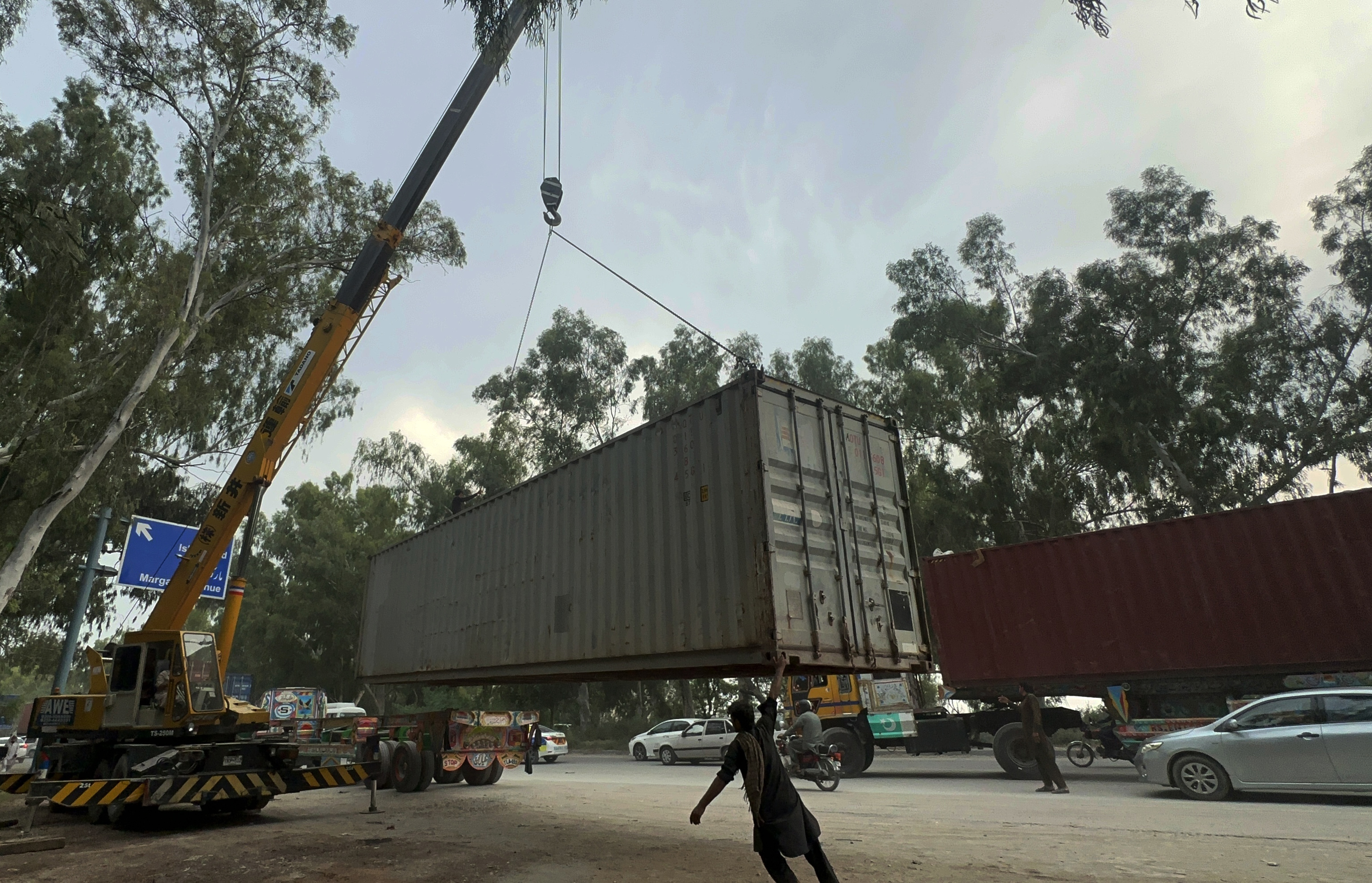 epa13239124 A view of containers set aside by authorities, allegedly to block a planned rally by the opposition Pakistan Tehreek-e-Insaf (PTI), on the outskirts of Islamabad, Pakistan, 14 September 2026. PTI's planned mobilisation in Punjab ahead of its 27 September protest in Islamabad has prompted a security crackdown. PTI says the protest seeks political rights and the release of jailed former prime minister Imran Khan. EPA/SOHAIL SHAHZAD