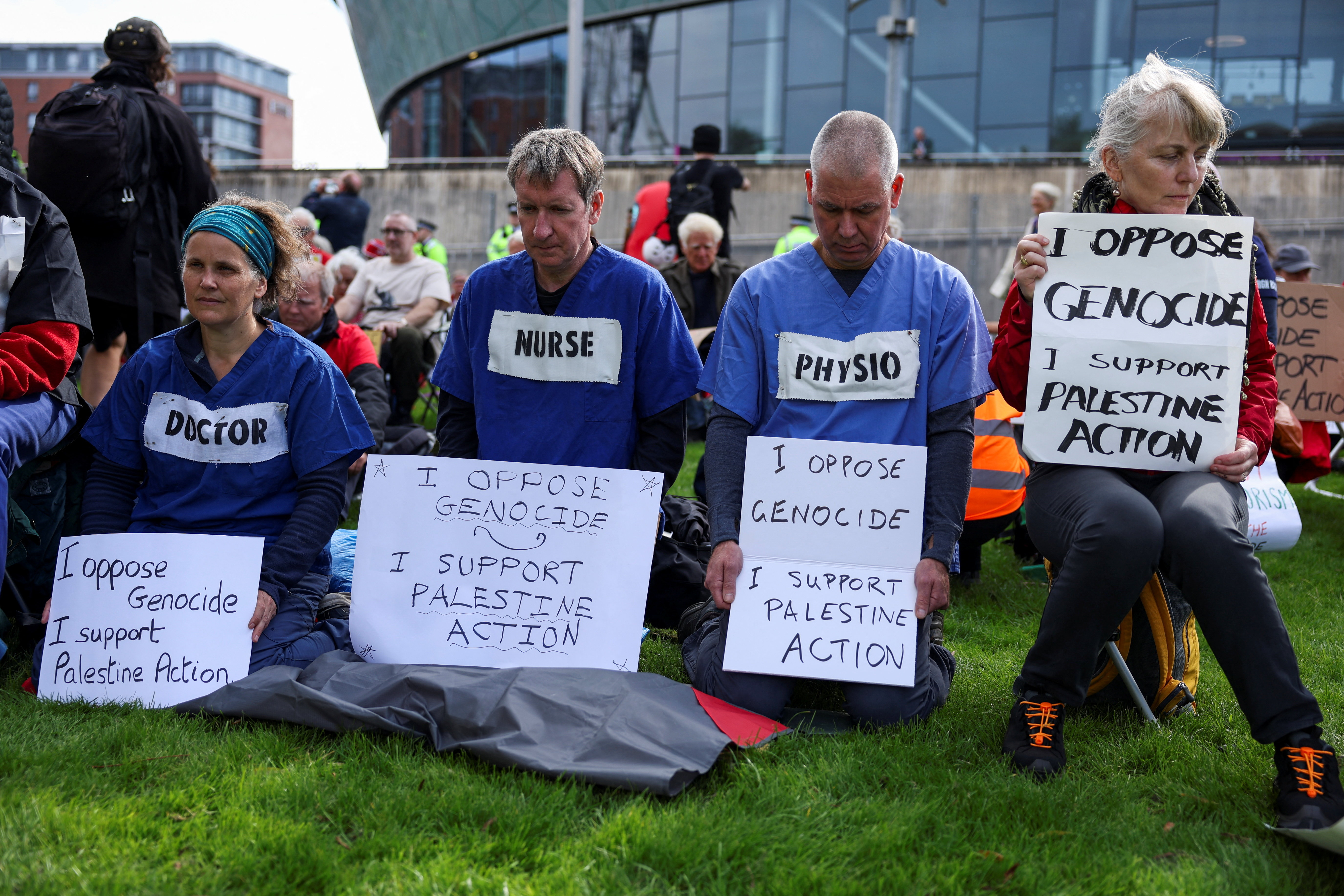 Campaigners from the Palestine Action Group hold signs during a protest outside the venue of the Labour Party’s annual conference in Liverpool, Britain, September 27, 2026. REUTERS/Temilade Adelaja