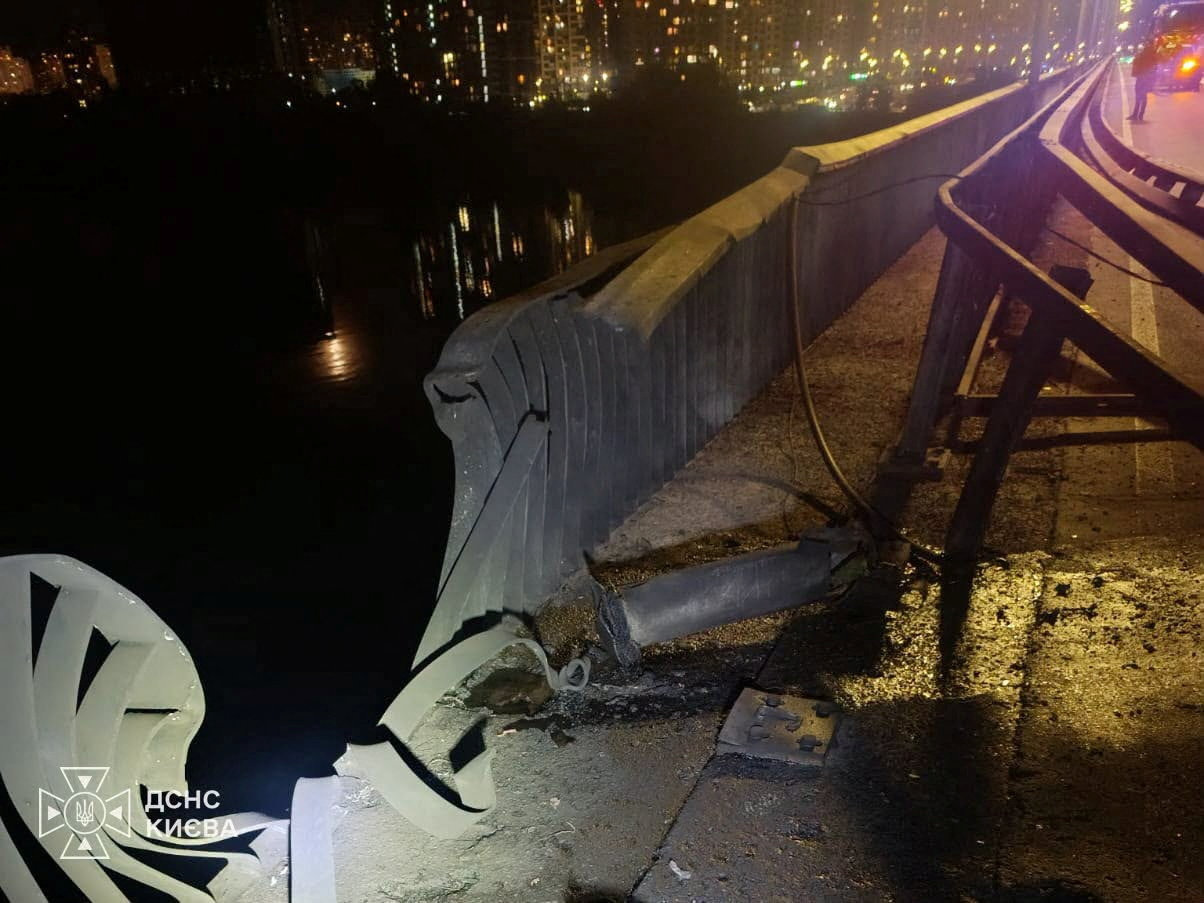 Damage appears on a bridge over the Dnipro River following a Russian drone strike, amid Russia's attack on Ukraine, in Kyiv, Ukraine, in this handout released October 2, 2026. Press service of the State Emergency Service of Ukraine in Kyiv/Handout via REUTERS ATTENTION EDITORS - THIS IMAGE HAS BEEN SUPPLIED BY A THIRD PARTY. DO NOT OBSCURE LOGO.