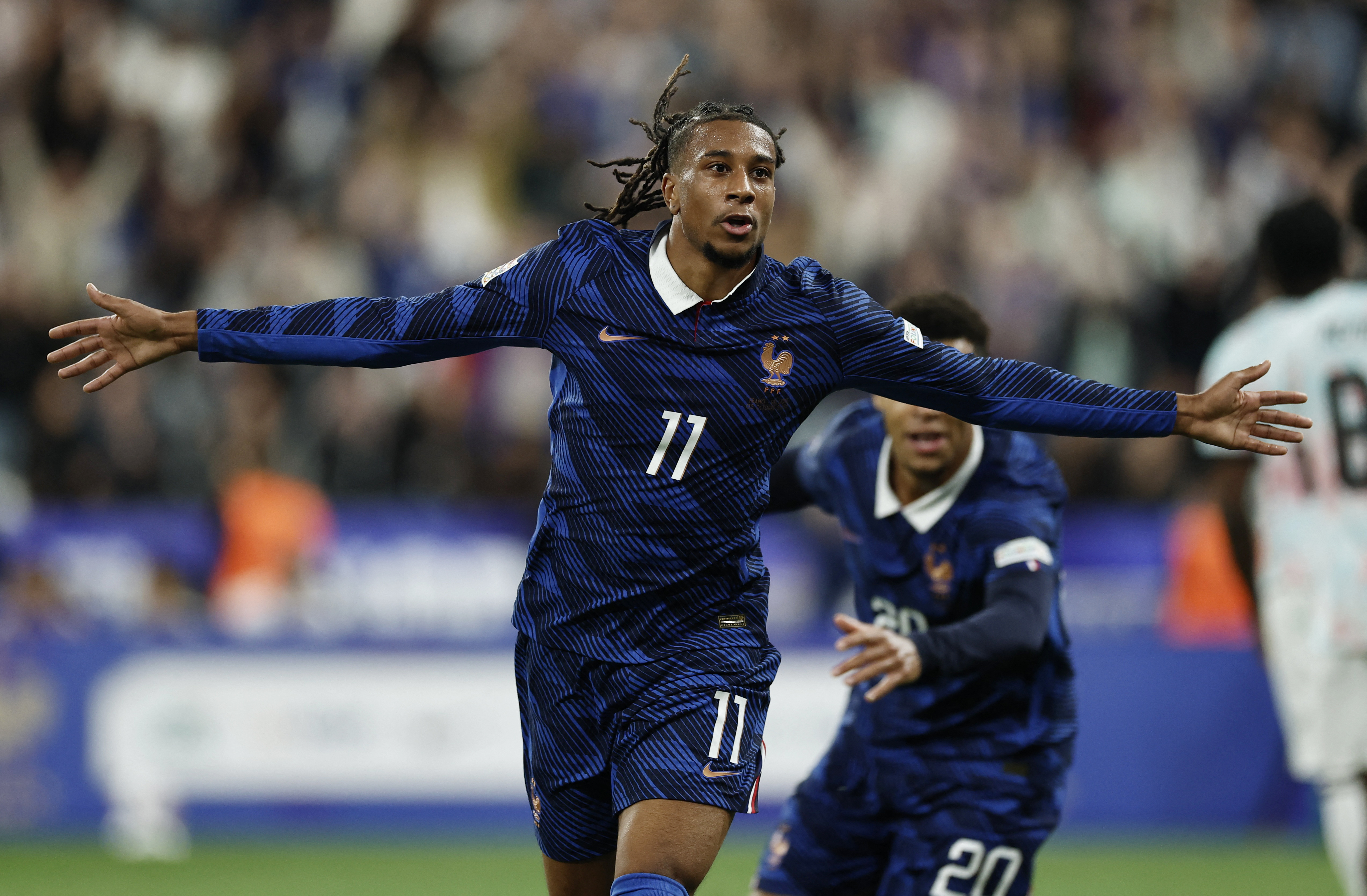 France's Michael Olise celebrates scoring their third goal