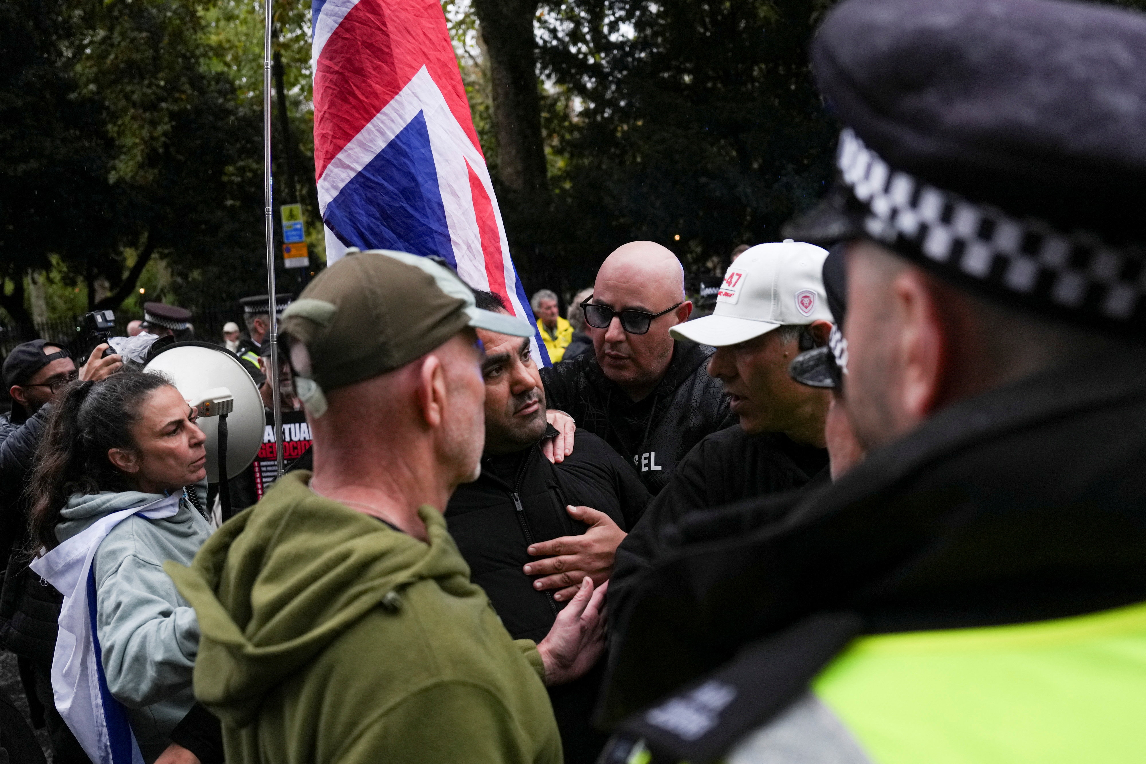 A demonstrator argues with the police as students take part in an inter-university march organized by the University of London Coalition in support of Palestinians, on the third anniversary of the October 7, 2023 attack on Israel by Hamas from Gaza, in London, Britain, October 7, 2026. REUTERS/Carlos Jasso
