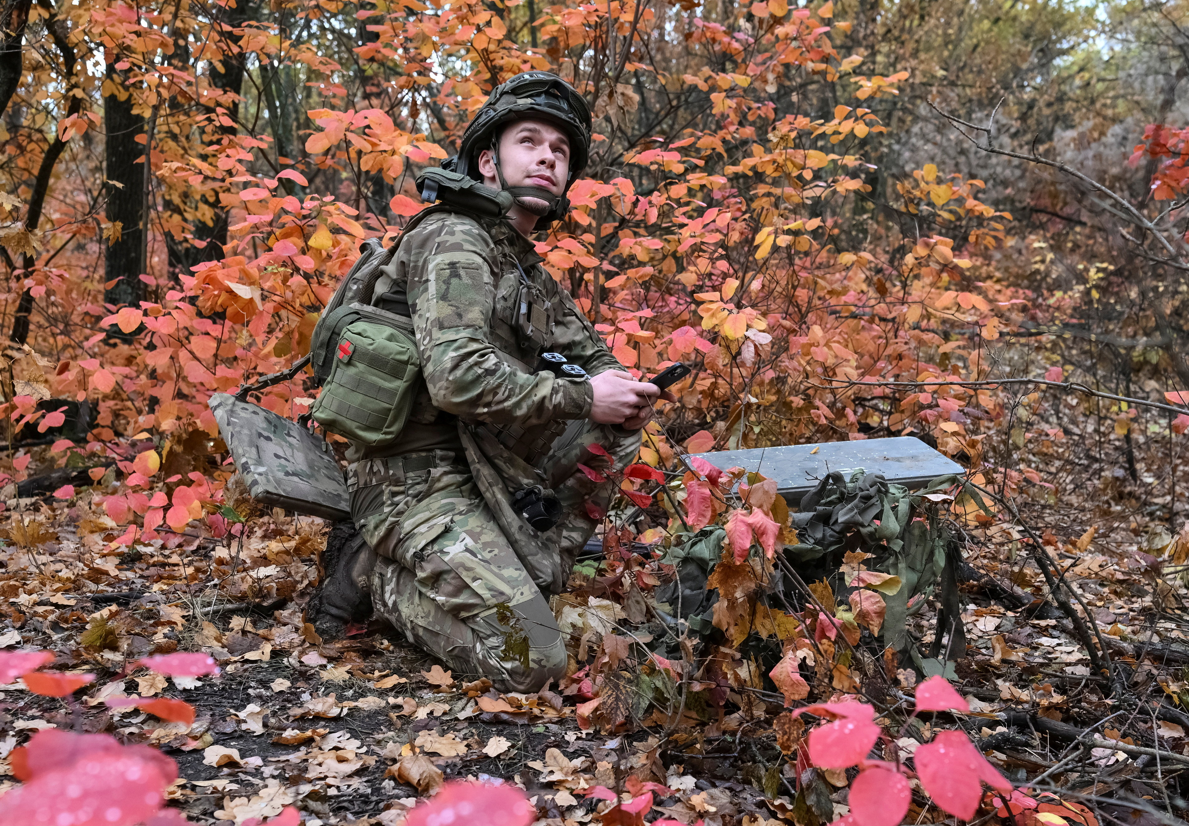 An artilleryman of the Special Rifle Police Battalion of Zaporizhzhia region sets up Starlink satellite internet system, at a position, amid Russia's attack on Ukraine, near the frontline in Donetsk region, Ukraine, October 16, 2026. REUTERS/Stringer