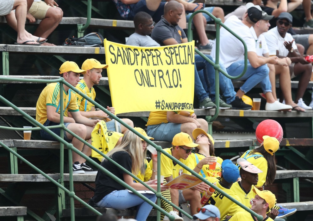 South African fans hold up banner with reference to the sandpaper scandal during the Fourth Test match between South Africa and Australia at the New Wanderers Stadium
