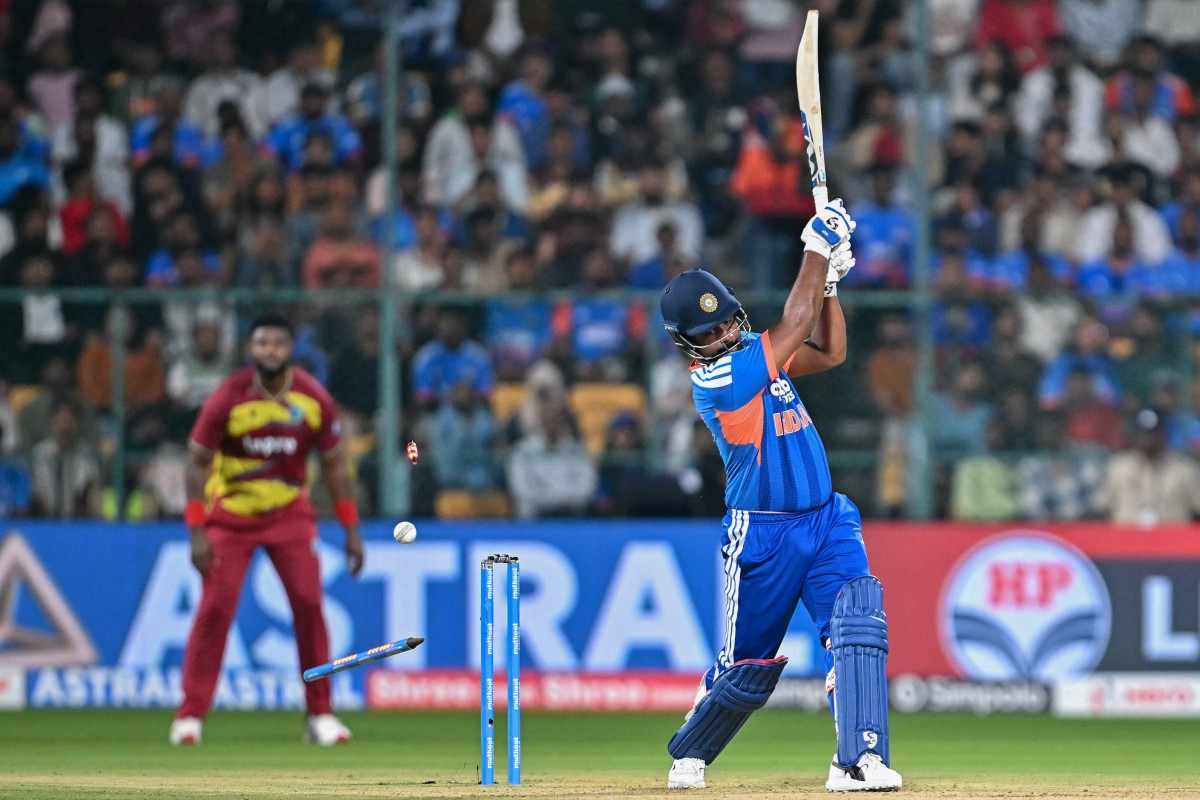 India's Sanju Samson is clean bowled by West Indies' Shamar Springer during the fifth T20 international cricket match