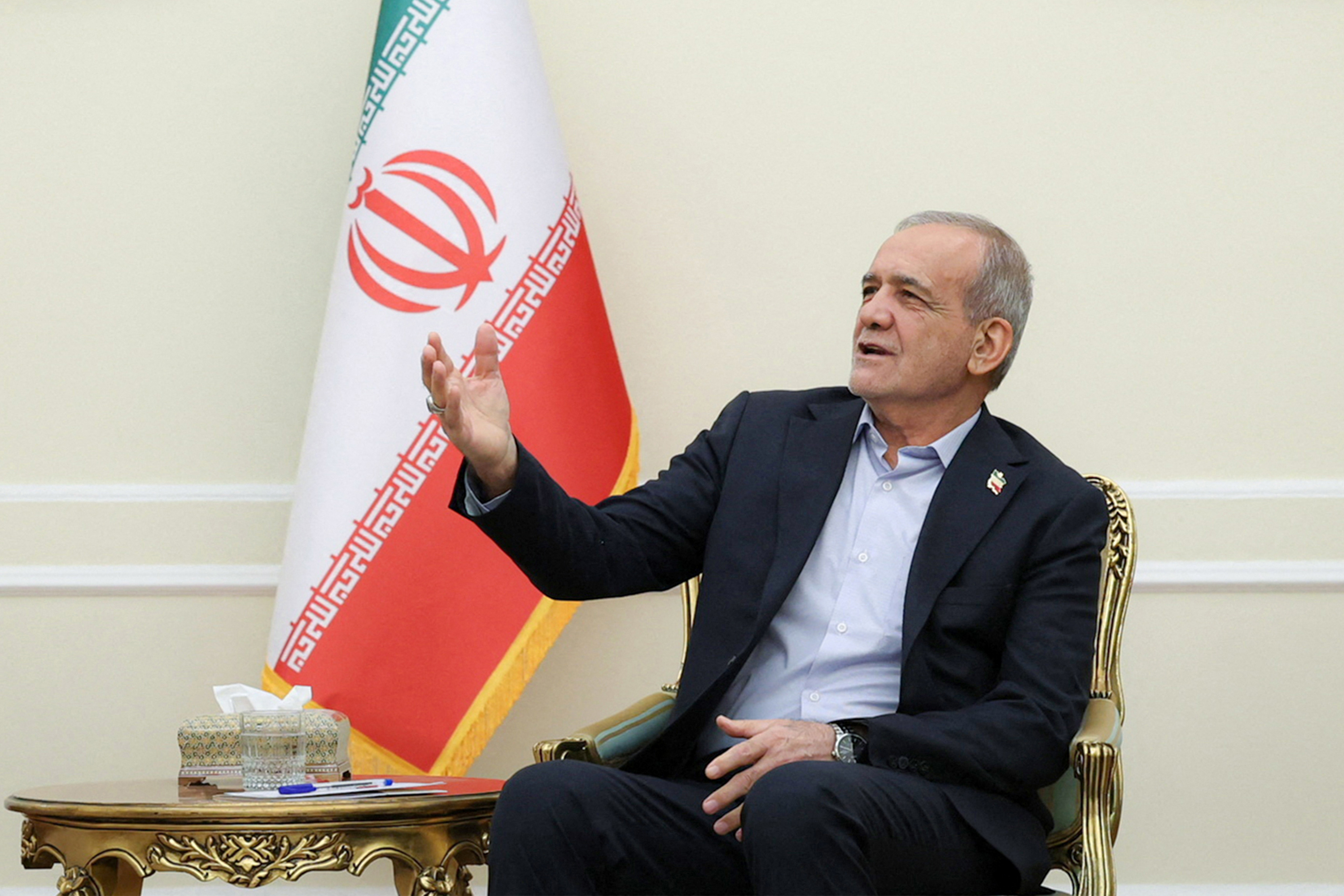 President Masoud Pezeshkian receives Pakistan's army chief in Tehran on Tuesday [Handout via AFP]